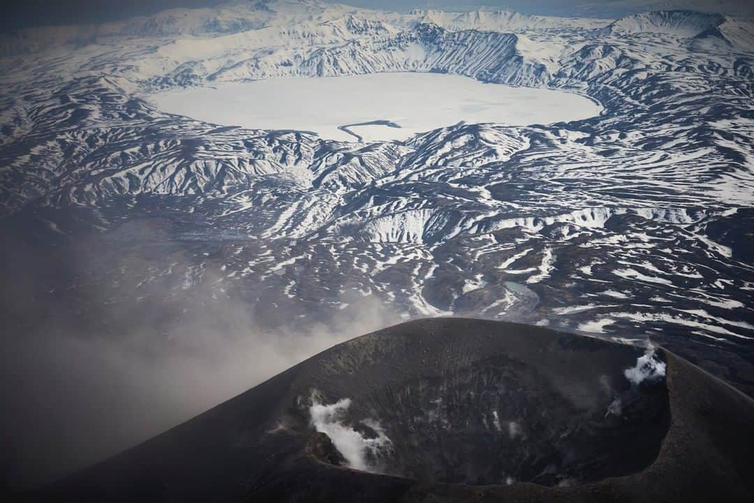 National Geographic Travelさんのインスタグラム写真 - (National Geographic TravelInstagram)「Photo by @simonnorfolkstudio I Karymsky (Russian: Карымская )is a stratovolcano and lake on the Kamchatka Peninsula, Russia, here photographed in winter, with the crater lake beyond. Karymsky is the most active volcano in the region and has been erupting continuously since a powerful earthquake struck the region in January 1996. Scientists are monitoring the volcano closely and despite the ecological catastrophe, Karymsky Lake is slowly recovering to pre-1996 conditions. Follow me @simonnorfolkstudiofor updates, outtakes, unpublished and archive material on this and future projects @natgeo #volcano #karymsky#Карымская#stratovolcano#Kamchatka #ringoffire #камчатка #volcanology #instagramrussia」3月27日 19時00分 - natgeotravel