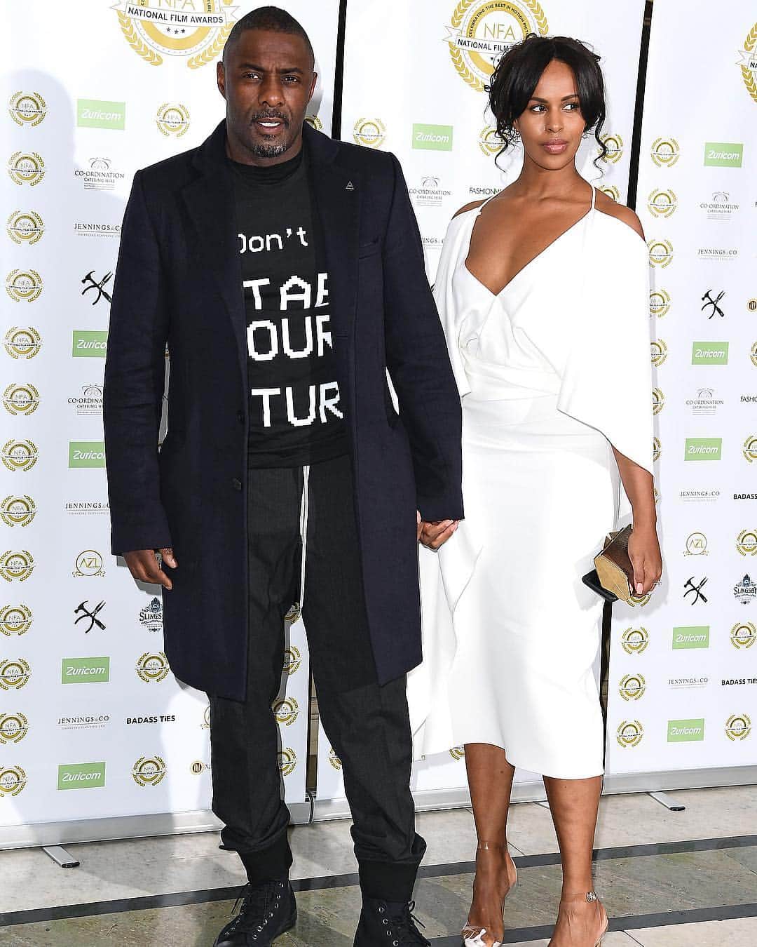 Just Jaredさんのインスタグラム写真 - (Just JaredInstagram)「@idriselba wears a “Don’t Stab Your Future” shirt referencing the rising incidents of knife crimes in London to the 2019 National Film Awards. He was joined by fiancée @sabrinadhowre on the red carpet.  #IdrisElba #SabrinaDhowre #NationalFilmAwards Photos: Getty」3月28日 15時07分 - justjared