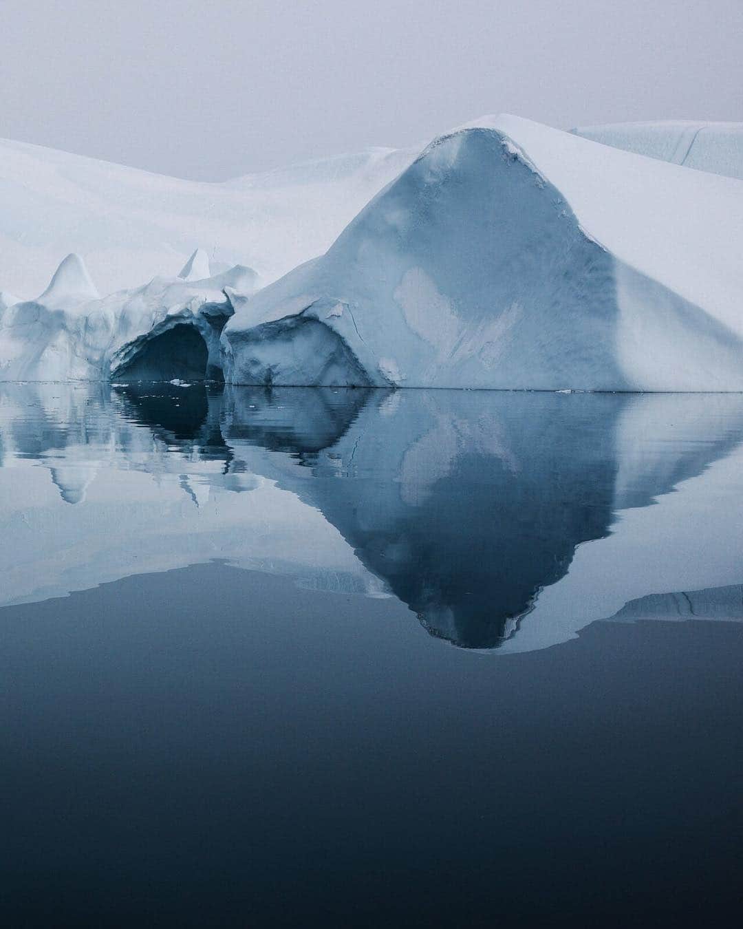 ナショナルジオグラフィックさんのインスタグラム写真 - (ナショナルジオグラフィックInstagram)「Photo by @ciriljazbec | One of the few places where ice from the Greenland ice cap enters the sea, Sermeq Kujalleq, or Jakobshavn, is one of the fastest and most active glaciers in the world. It annually calves over 35 kilometers of ice; that's 10% of the production of ice calving in Greenland, and more than any other glacier outside Antarctica. Seeing the glacier so close-up was mesmerizing, and so was picturing the further magnitudes below and inside of this gigantic sight. Follow more @ciriljazbec from my latest Arctic expedition.  #Arctic #Greenland #climatechange #glacier #melting」3月30日 7時15分 - natgeo