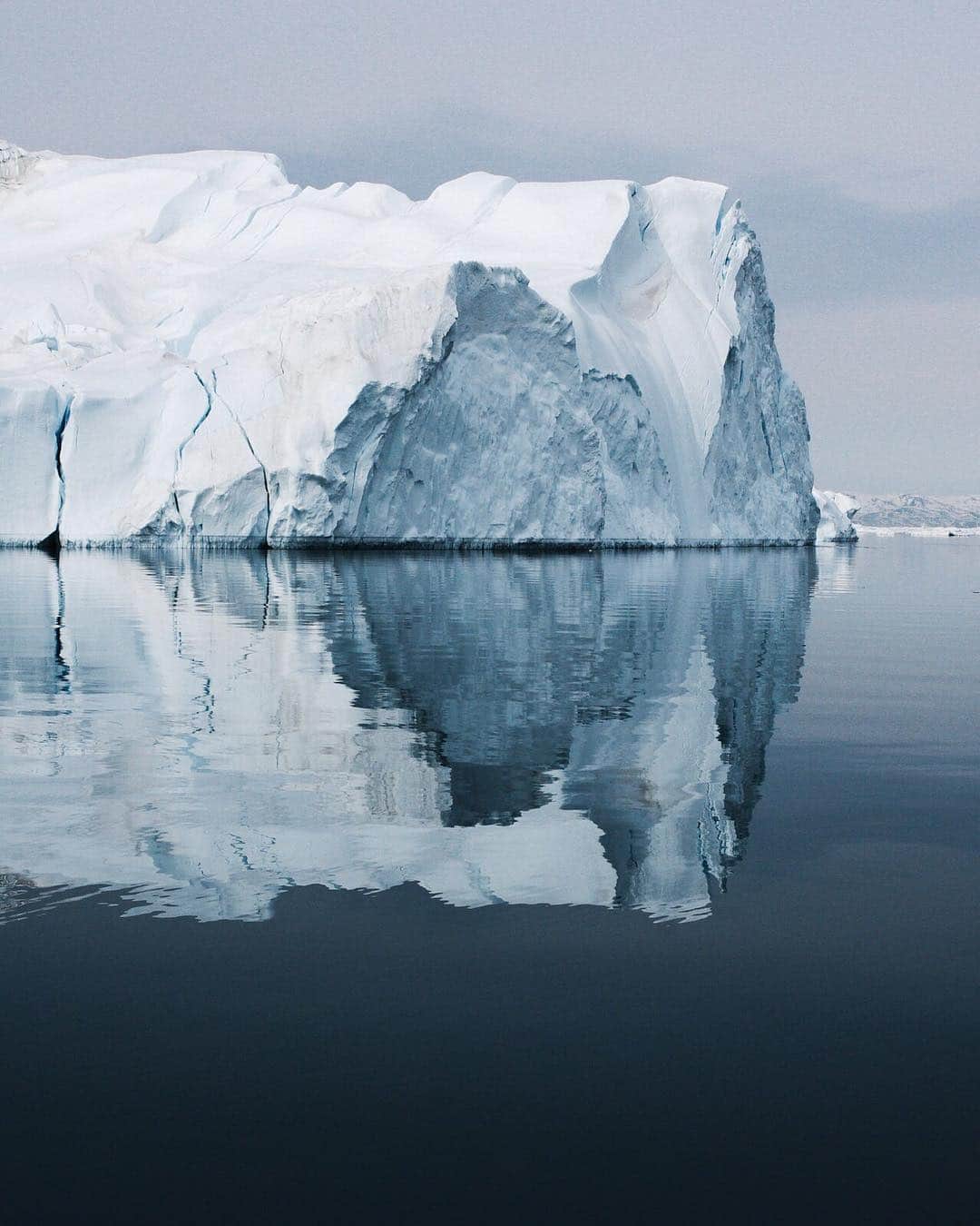 ナショナルジオグラフィックさんのインスタグラム写真 - (ナショナルジオグラフィックInstagram)「Photo by @ciriljazbec | One of the few places where ice from the Greenland ice cap enters the sea, Sermeq Kujalleq, or Jakobshavn, is one of the fastest and most active glaciers in the world. It annually calves over 35 kilometers of ice; that's 10% of the production of ice calving in Greenland, and more than any other glacier outside Antarctica. Seeing the glacier so close-up was mesmerizing, and so was picturing the further magnitudes below and inside of this gigantic sight. Follow more @ciriljazbec from my latest Arctic expedition.  #Arctic #Greenland #climatechange #glacier #melting」3月30日 7時15分 - natgeo