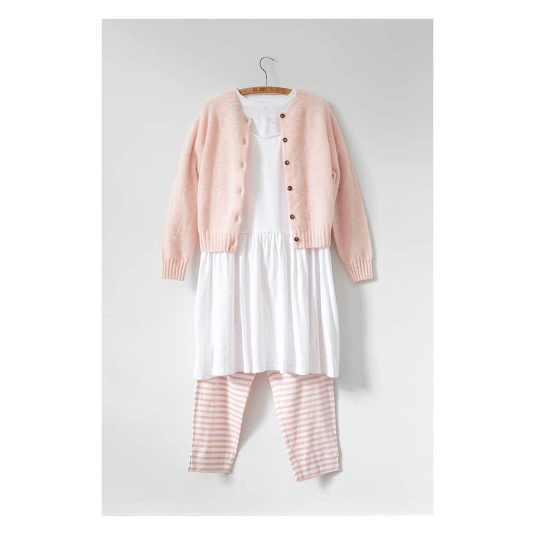 キャベジズ&ローゼズのインスタグラム：「Layers on layers on layers 💕 Get weekend ready with one of our favourite outfits. When worn together, the 100% pure new wool Lily Cardigan, the short Ella Dress in white organic cotton, the Terrance T-shirt in organic Rosabelle and the Terry Trousers in pink stripe make a great off-duty look 👇Tap To Shop👇#scottishknitwear #shabbychicliving #shabbylovescabbagesandroses #pinkcardigan #limitedpieces #ss19collection #springlook #organicclothing #cabbagesandrosesfashion #cabbagesandroses @christina_strutt @cabbagesandroses_shop」