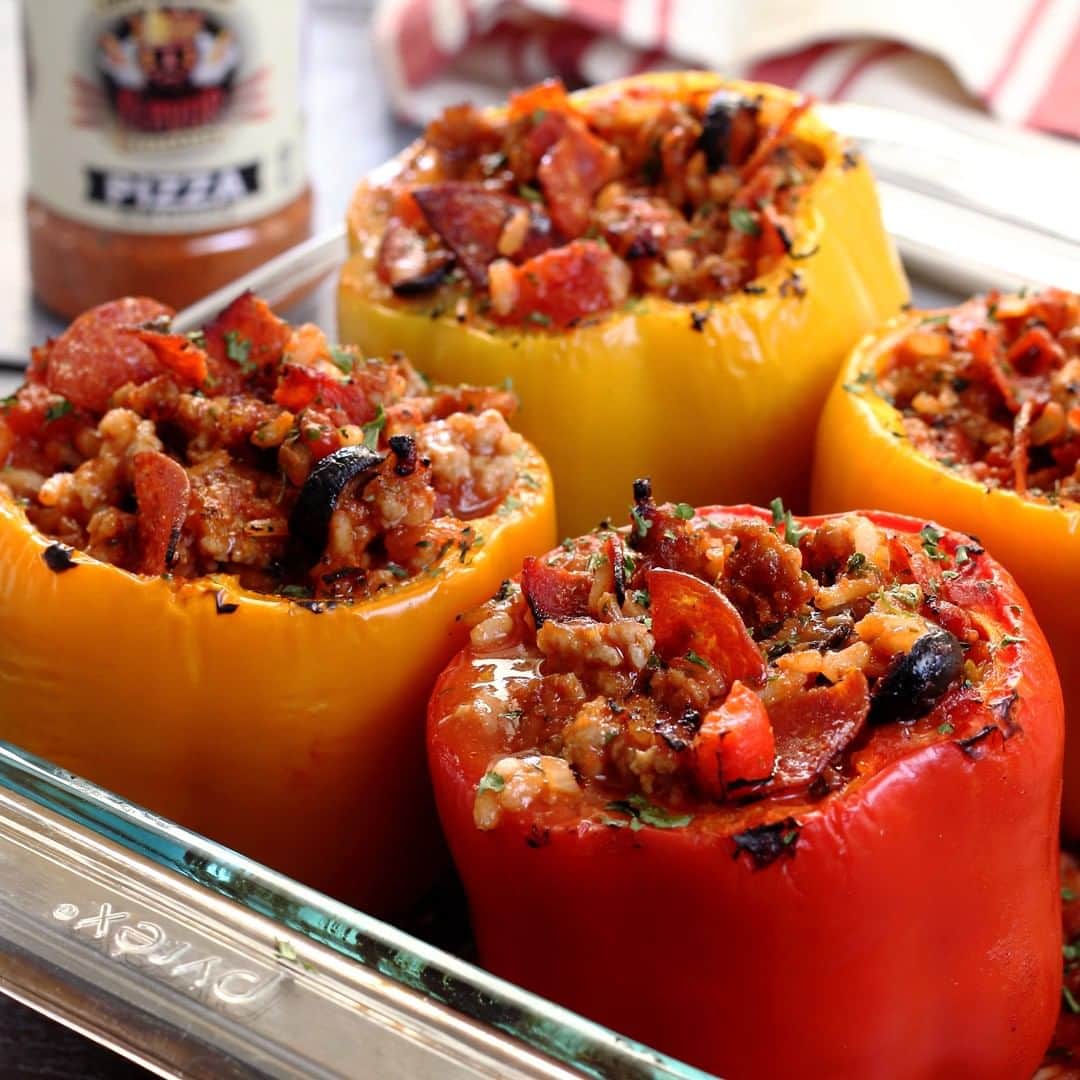 Flavorgod Seasoningsさんのインスタグラム写真 - (Flavorgod SeasoningsInstagram)「STUFFED PIZZA PEPPERS 🍕🍕🍕⁣ .⁣ Made with:⁣ 👉 #flavorgod Pizza Seasoning ⁣ 👉 #flavorgod⁣ -⁣ On Sale here ⬇️⁣ Click the link in the bio -> @flavorgod⁣ www.flavorgod.com⁣ .⁣ Healthy stuffed peppers with some of your favorite pizza fixings from ⁣ @paleo_newbie_recipes and featuring @flavorgod Pizza seasoning⁣ ⁣ INGREDIENTS⁣ ⁣ 6 bell peppers, tops and seeds removed – reserve tops⁣ 1 lb Italian sausage - sweet or spicy⁣ 1 medium onion, chopped⁣ 2 garlic cloves, minced⁣ 1 jar (14 oz) fire-roasted tomatoes, liquid drained⁣ 1 can (14 oz) tomato sauce⁣ 2 oz of pepperoni slices, chopped⁣ 1/3 cup sliced black olives⁣ 1-2 Tbsp Flavor God Pizza Seasoning⁣ 1 cup pre-made white rice or cauliflower rice⁣ Optional: Pinch of chili flakes for extra heat; cheese for topping⁣ ⁣ ⁣ INSTRUCTIONS⁣ ⁣ Preheat oven to 350º F⁣ ⁣ Cut tops off peppers and remove seeds. Chop tops (minus the stems) and ⁣ set aside.⁣ ⁣ In a skillet over medium heat, sauté chopped onion and chopped pepper ⁣ tops with a little olive oil about 5 minutes, or until onions are tender⁣ ⁣ Next add the garlic and sausage to skillet – cook until meat is browned.⁣ ⁣ Next add the fire roasted tomatoes, tomato sauce, chopped pepperoni, and ⁣ black olives and stir⁣ ⁣ Now add 1-2 Tbsp @flavorgod Pizza Seasoning, plus some chili flakes if ⁣ desired.⁣ ⁣ Finally add the pre-made white rice or cauliflower rice to the skillet ⁣ and stir. Taste mixture and add more seasoning if needed.⁣ ⁣ In a deep baking dish, spread some sauce across the bottom to keep ⁣ peppers from sticking.⁣ ⁣ Set pepper shells inside dish and spoon pizza stuffing into each. Top ⁣ with cheese if desired.⁣ ⁣ Bake about 30-40 minutes uncovered. Serve hot and enjoy!⁣」3月31日 10時00分 - flavorgod