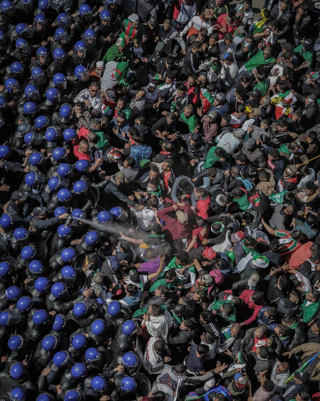 TIME Magazineさんのインスタグラム写真 - (TIME MagazineInstagram)「Algerian riot police clash with demonstrators taking part in a mass #protest against President Abdelaziz Bouteflika, after his decision to postpone the April presidential elections and to stay in power after his current term ends for an unspecified transitional period, in Algiers on March 29. Bouteflika, 82, has been running #Algeria since 1999 and until 2011 was doing so under emergency rule. In 2013, he suffered a stroke and has been seen very rarely in public ever since; his last public speech was in 2014. The reality is that his handlers (which include his brother and certain key military officials) have been running the country in his absence. The prospect of reelecting an infirm, largely incapacitated elderly person—which in effect means electing his patronage network—is too much for Algerians already aggrieved by the country’s political and economic situation to bear, writes Ian Bremmer. Read more about the historic protests in Algeria at the link in bio. Photograph by Farouk Batiche—picture alliance/@gettyimages」3月31日 2時34分 - time