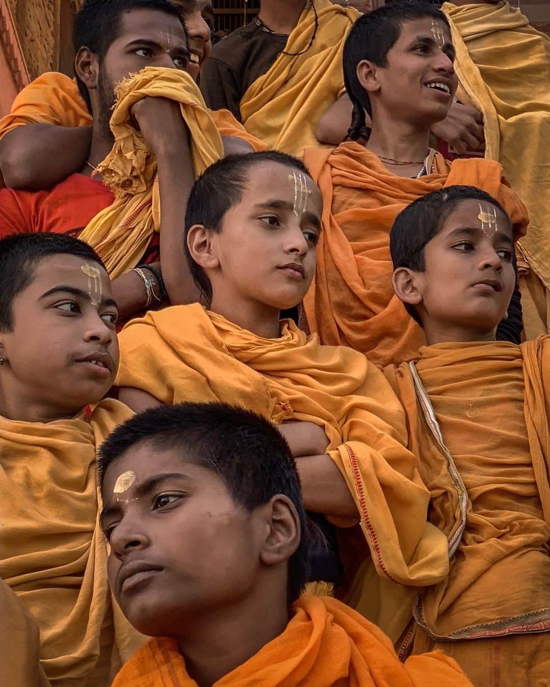 National Geographic Travelさんのインスタグラム写真 - (National Geographic TravelInstagram)「Photo by @johnstanmeyer | We came upon these boys at the Ganges River three weeks ago while I was walking with Paul Salopek on @outofedenwalk in Varanasi. They were watching others make their pujas, offerings to the sacred river, one of those moments in passing something pleasantly magical happens. #onassignment @natgeo @outofedenwalk @natgeoimagecollection #india #varanasi #hinduism #boys #yellow #orange」3月31日 19時04分 - natgeotravel