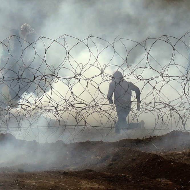 NBC Newsさんのインスタグラム写真 - (NBC NewsInstagram)「A Palestinian protester runs away from the border fence along the Gaza Strip as Palestinians demonstrate to mark the anniversary of their mass protests along the Israeli border. Most demonstrators kept their distance from the border, though small crowds of activists approached the perimeter fence and threw stones and explosives toward Israeli troops on the other side. The forces fired tear gas and opened fire, killing 4 Palestinians and wounding 64. Read more at the link in our bio. . 📷 Jack Guez / @afpphoto」4月1日 2時59分 - nbcnews
