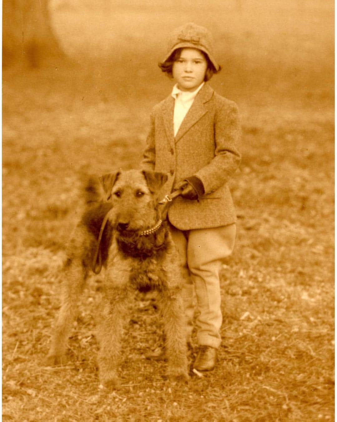 グロリア・ヴァンダービルトのインスタグラム：「A friend sent me this photo the other day. I’d never seen it before. It is me with my Airedale in France, where i lived with my mother, and grandmother Morgan, and my nanny, whom I called Dodo.  Plans were already afoot to get me back to America, I’d hear whispers between Dodo and my grandmother, but I did not know what it meant, and all that lay ahead.」
