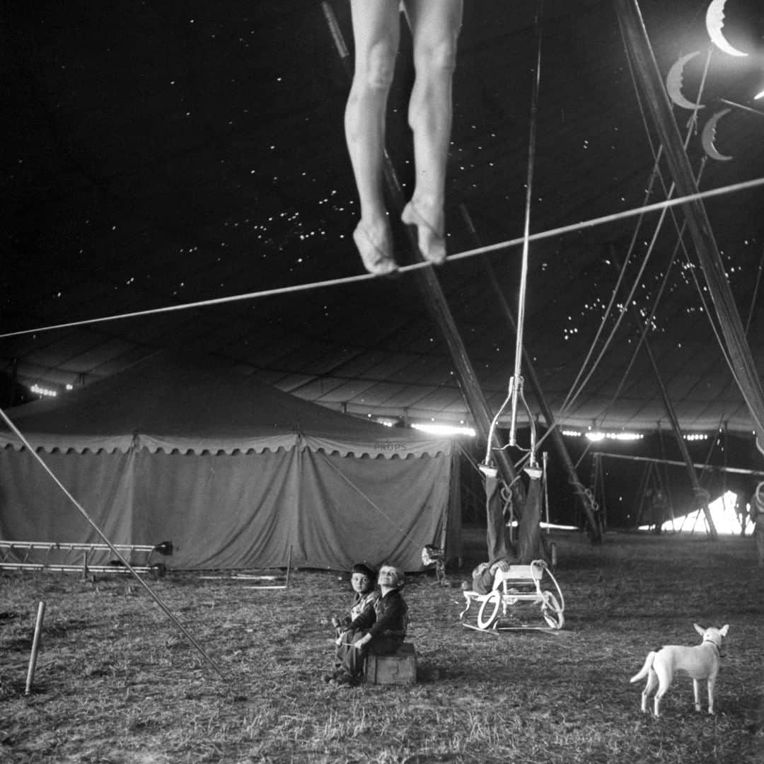 lifeさんのインスタグラム写真 - (lifeInstagram)「70 years ago this week from the April 1, 1949 feature story in LIFE: "CIRCUS GETS READY—The Big Show's girls learn acrobatics from the ground up for grand tour." This image ran with the following caption: "Nothing but circus all day every day is the happy fate of these two performers' tots, who sit around the big tent watching as the pretty Miss Lola practices on a tightwire and an acrobat balances an odd contraption on his fee." (Nina Leen—The LIFE Picture Collection/Getty Images) #thisweekinLIFE #Circus #RinglingBrothers」4月1日 22時11分 - life