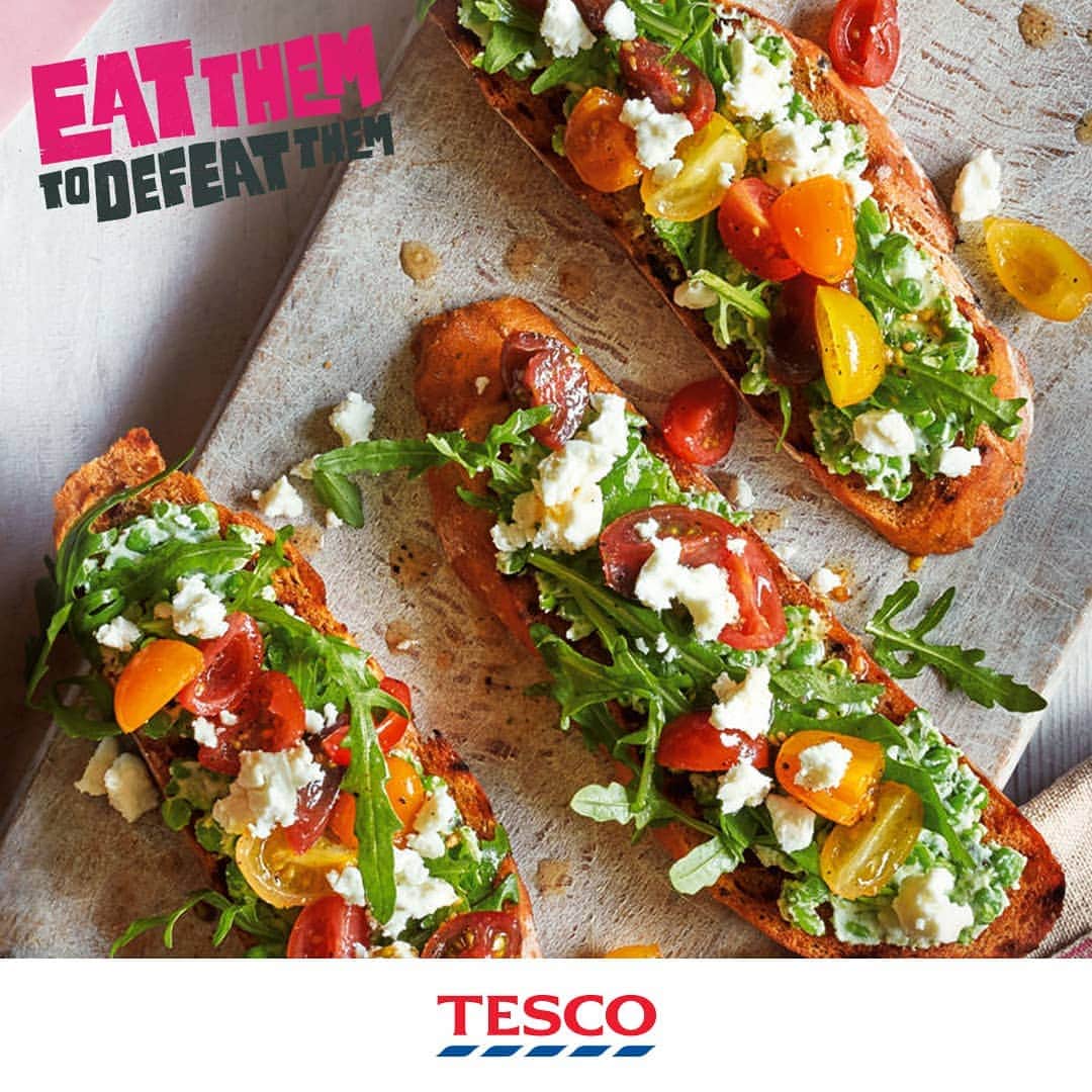 Tesco Food Officialさんのインスタグラム写真 - (Tesco Food OfficialInstagram)「Let’s hurl some tomatoes! That’s the veggie we’re ganging up on for this week’s #EatThemToDefeatThem challenge from @vegpoweruk and @ITV. Give them the chop with this deliciously easy, super colourful pea, feta and tomato bruschetta.  #5aDay #VegPower  Ingredients  120g mixed baby tomatoes, quartered few basil leaves, torn 1 tsp white wine vinegar 2 tsp olive oil 100g frozen peas, defrosted 40g feta 4 diagonal slices, cut from 400g loaf Mediterranean bread 25g rocket leaves  Method  1. Marinate all of the tomatoes by mixing them with the basil leaves, vinegar and olive oil in a bowl. Season and set aside.  2. In a small pan of boiling salted water, blanch the peas for 2 mins and drain. While still warm, mash the peas with half the feta using a fork. Toast the bread slices and spread the pea and feta mixture over the top, dividing equally between each slice.  3. Garnish with a little rocket, then spoon over the marinated tomatoes and their juices. Crumble over the remaining feta and top with the rest of the rocket leaves.」4月2日 19時03分 - tescofood