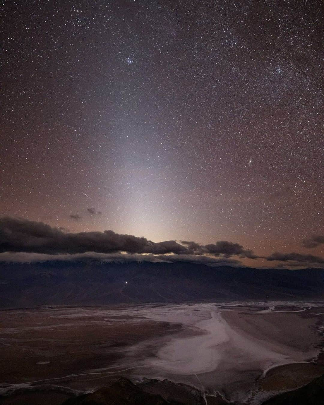 National Geographic Travelさんのインスタグラム写真 - (National Geographic TravelInstagram)「Photo by @BabakTafreshi | On a 5500ft (1670m) viewing point in Death Valley National Park In this stunningly dark starry sky the elongated cone-shape natural glow is known as Zodiacal Light, only visible in dark skies far from light pollution, after dusk or before dawn, created by sunlight reflecting from asteroid dust in the Solar System. Down on Earth you are looking at a salt flat which marks the lowest point in the entire North America, 280ft (85m) under the sea level!  I’m on a @natgeo assignment to document the impact of artificial lights and the value of natural nights. Explore more @babaktafreshi. #saveournightsky #twanight #nightsky #zodiacallight #astrophotography @deathvalleynps @natgeoimagecollection」4月3日 19時04分 - natgeotravel