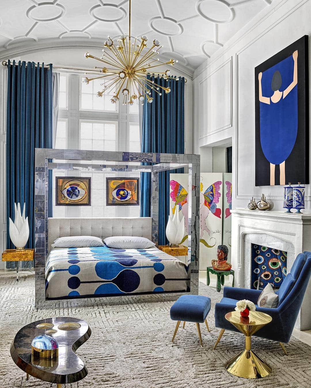 ELLE DECORさんのインスタグラム写真 - (ELLE DECORInstagram)「An eclectic and bold spirit is brought to life in this charming bedroom in @jonathanadler and @simondoonan’s Greenwich Village apartment. Here, the vintage bed is by Paul Evans, and the armchair, ottoman, cocktail table, drinks table, nightstands, chandelier, and rug are all by Adler. The curtains are by @kravetinc, the art over the mantle is by @mcfetridge, and the works behind the bed are @JohnPaulPhilippe. Click the link in bio for the full tour. Photography by @thefacinator」4月4日 6時41分 - elledecor