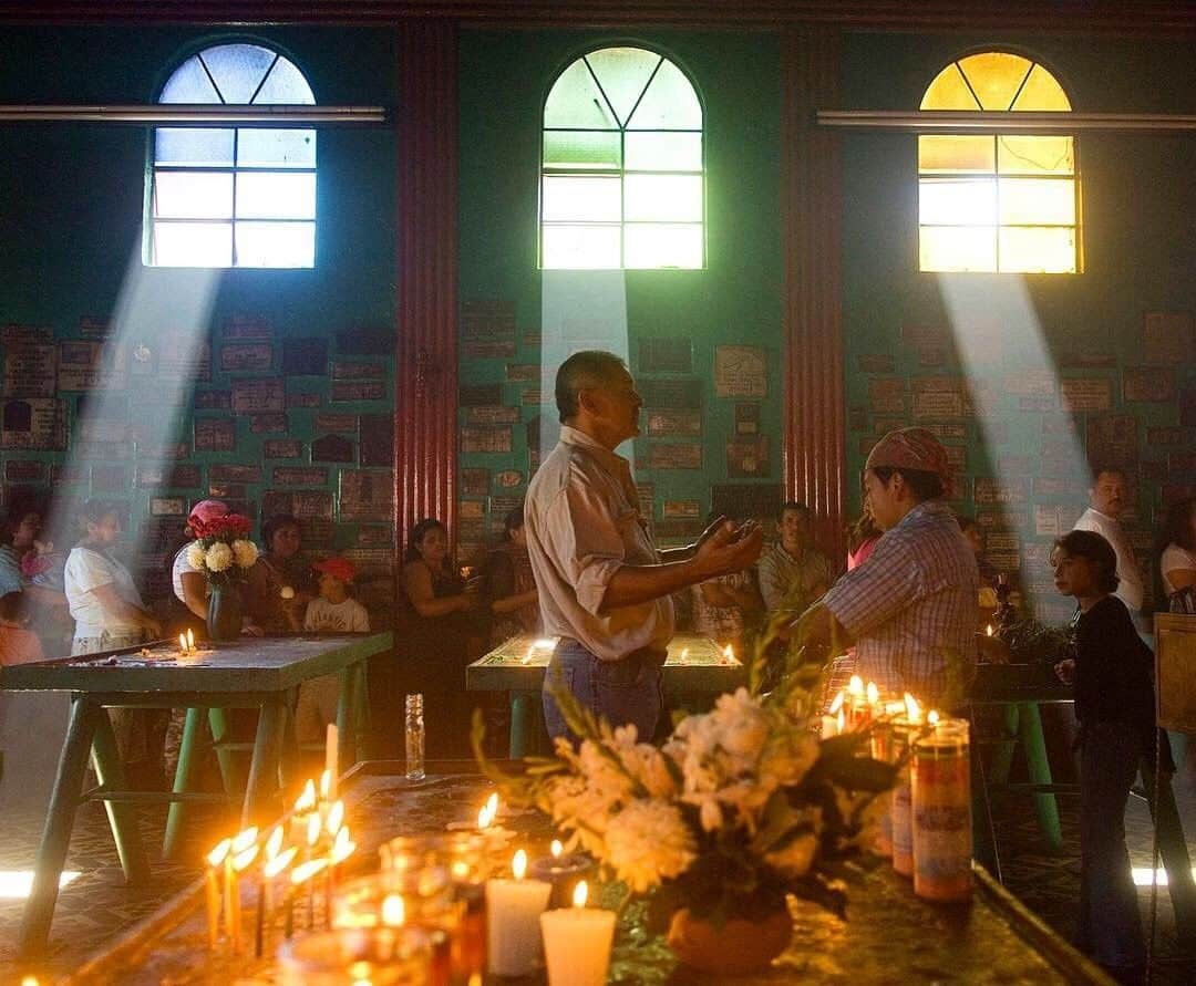 National Geographic Travelさんのインスタグラム写真 - (National Geographic TravelInstagram)「Photo by Pete McBride @pedromcbride | Bathed in light and the prayers of a shaman, one man, among many, comes to this church to be cleansed. Here, outside of Antigua, Guatemala, worshipers follow a mixture of Catholicism and Mayan religion. This cultural blend means that, depending on who you ask, you'll get a wide range of opinions on Maximón, the Mayan god they pray to, ranging from mischievous to saintly. For more images of cultures around the world, follow @pedromcbride #petemcbride #guatemala #mayan #religion」5月3日 4時14分 - natgeotravel