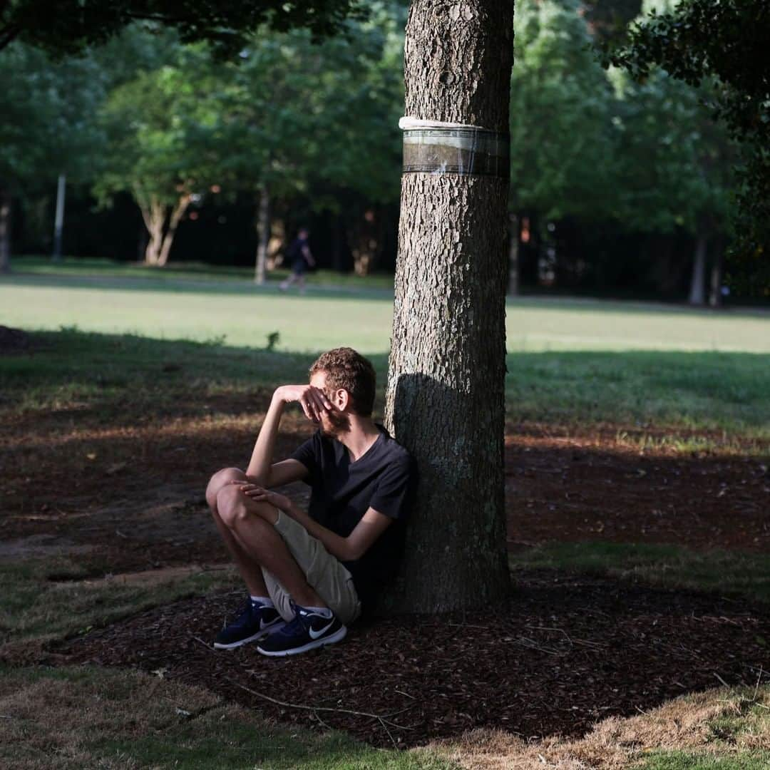 TIME Magazineさんのインスタグラム写真 - (TIME MagazineInstagram)「A student sits under a tree after an on-campus shooting at @unccharlotte on April 30. Authorities are praising a slain student as a hero for “taking the fight” to the gunman, who had "quite a bit of ammo," as the attack began at the school's Kennedy building on Tuesday. Riley Howell, 21, lunged and “took the assailant off his feet." Howell was said to have followed active-shooter training, which instructs people to “run, hide, fight.” Soon after, a local police chief said, officers rushed into the classroom and disarmed the assailant. Howell and 19-year-old classmate Ellis Parker were killed. Four others were wounded. Read more at the link in bio. Photograph by @logancyrus—@afpphoto/@gettyimages」5月3日 8時07分 - time