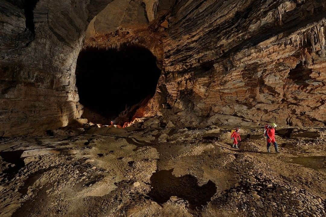 National Geographic Travelさんのインスタグラム写真 - (National Geographic TravelInstagram)「Photo by Robbie Shone @shonephoto | Explorers emerge from a giant black hole with a notebook full of survey data from previously unexplored galleries.  In the entrance series of San Wang Dong cave, China, this passage is called The Sea of Tranquility. Here lies the remains of old Nitrate mining that covers the floor in the form of harths, pits and unwanted spoil.」4月29日 9時56分 - natgeotravel