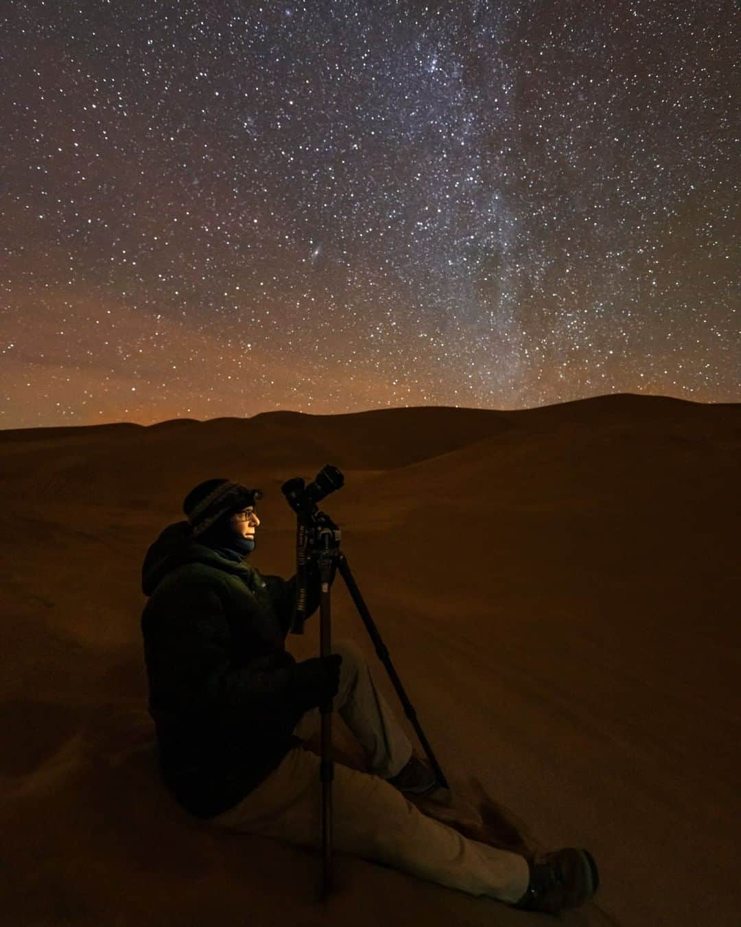 National Geographic Travelさんのインスタグラム写真 - (National Geographic TravelInstagram)「Photo by @BabakTafreshi | There are endless wonders and adventures for those who stay awake to experience the night. Like the explorers of the unseen, stargazers enjoy the view that most people miss while sleeping or spending night under grey star-free skies of the cities. In this pitch black dark night of Colorado’s Great Sand Dunes National Park my colleague @mikeshawphotography was enjoying the moment. Taking photos of the hidden Earth and shining sky felt beyond technical or artistic joy of photography. It is often a connecting bridge to the entire universe, a connection to our past and origin and to our future and destiny as an intelligent species. Follow me @babaktafreshi for more of The World at Night photography. #astrophotography #stargazing #nationalparks #twanight」4月29日 22時05分 - natgeotravel