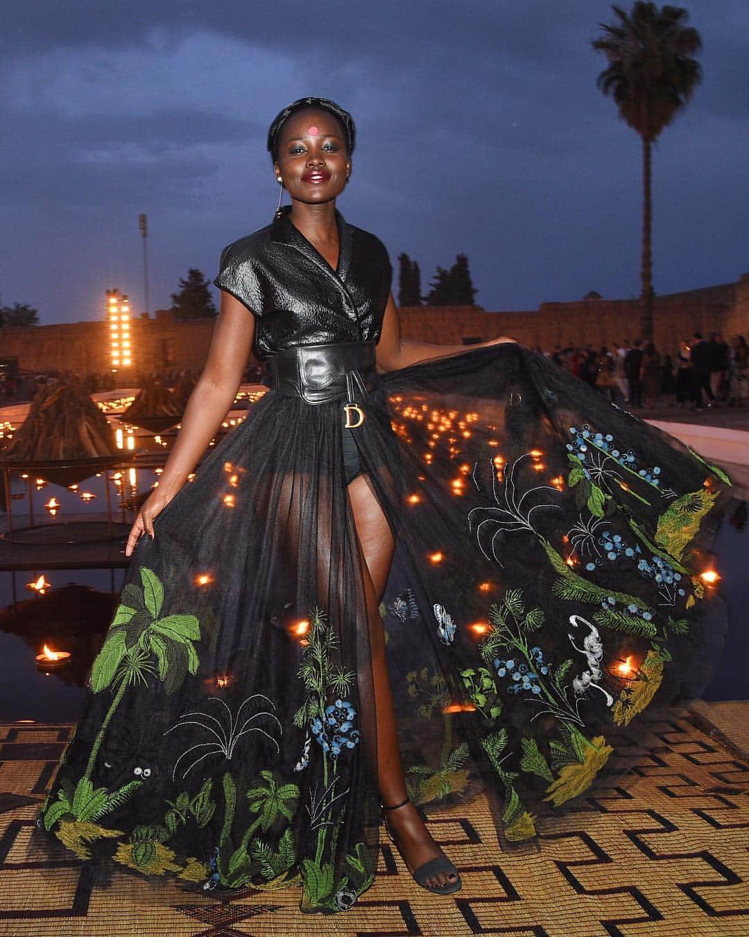 British Vogueさんのインスタグラム写真 - (British VogueInstagram)「This evening #LupitaNyongo attended the #DiorCruise show at the Palais El Badi in Marrakech. The collection was unveiled within the courtyard of the 16th century fortress, illuminated with hundreds of torches. Click the link in bio to see every look from the show.」4月30日 6時29分 - britishvogue