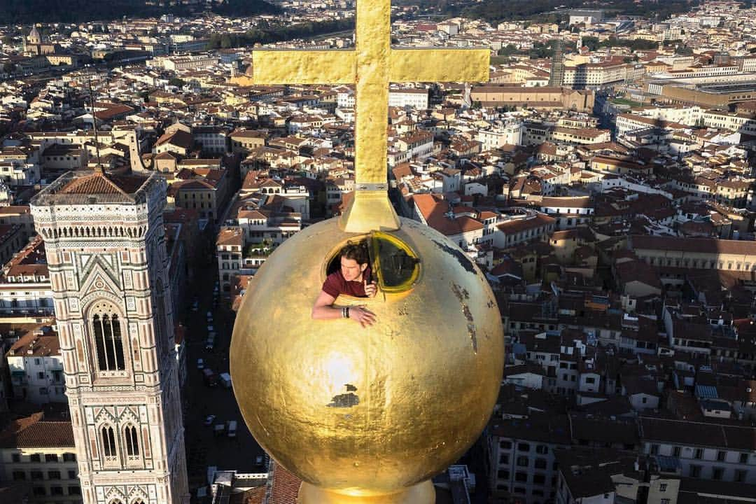 thephotosocietyさんのインスタグラム写真 - (thephotosocietyInstagram)「Photo by Paolo Woods and Gabriele Galimberti @gabrielegalimbertiphoto and @paolowoods | Sandro Schievenin works for the Opera Santa Maria del Fiore, which runs the complex of monuments and museums, including the Duomo of Florence. He was photographed in the orb that caps the dome during a routine checkup visit. The dome was designed by Brunelleschi. The orb, or the “palla” as it is known in Italy, is a copper hollow sphere—gilded in gold, 2.30 meters in diameter and weighing more than 18 tons—placed atop the dome. It was constructed by the workshop of Verrocchio in 1469, and Leonardo da Vinci, an apprentice of Verrocchio at the time, actively worked at designing and constructing the orb. According to Vasari, the orb “required much care and ingenuity, to make it possible to enter the ball from below, and make it proof against damage from the wind”. Later in life Leonardo recalled the construction, in a note from around 1515: “Remember the solders used for soldering the ball on Santa Maria del Fiore in ’69.” This was a time when he was involved in a scheme to manufacture parabolic mirrors, made of a number of facets soldered together. #leonardo #leonardodavinci #firenze #italy #florence #verrocchio #dome #duomo #brunelleschi」4月30日 21時07分 - thephotosociety