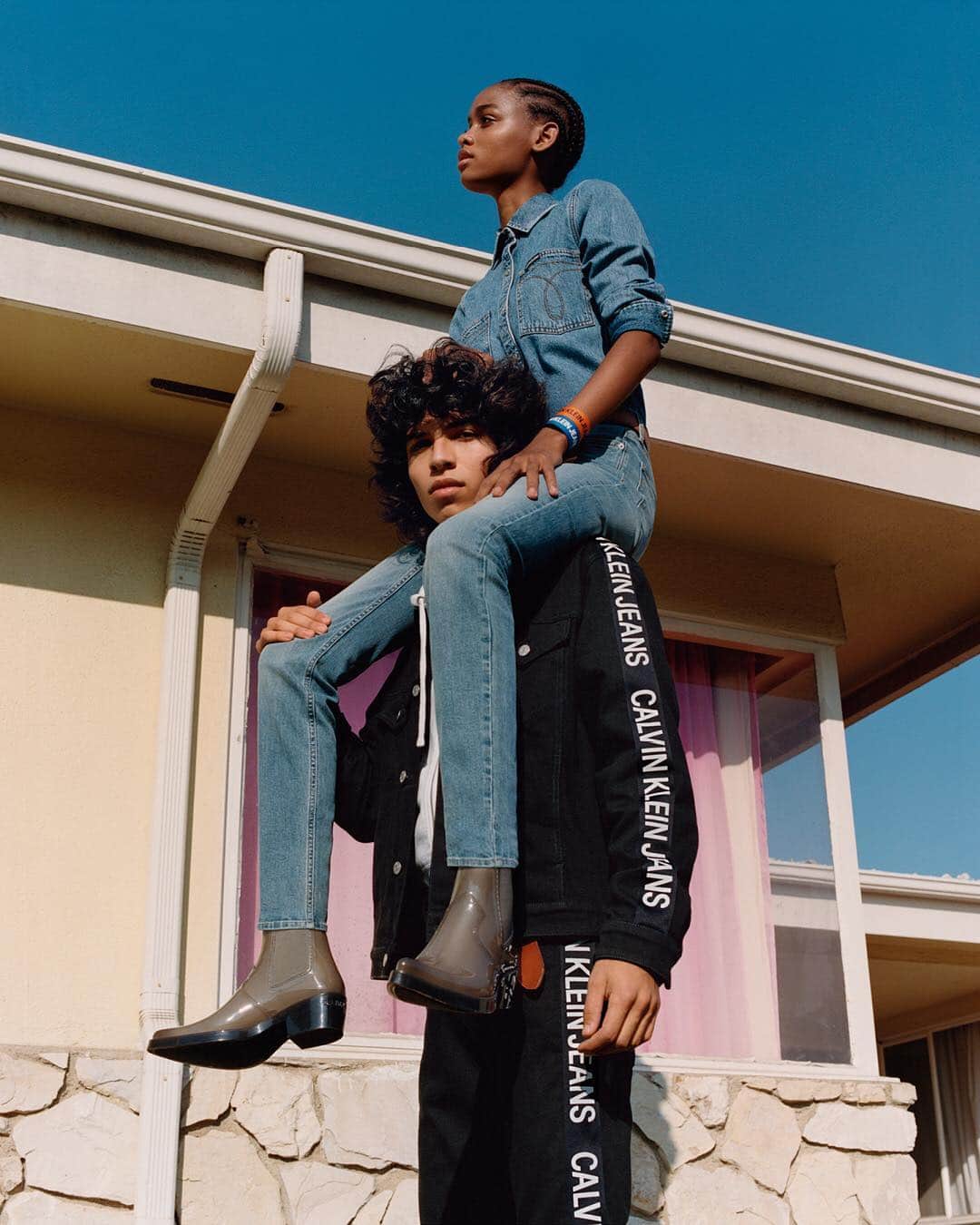 のインスタグラム：「Next-level #denim — discover new arrivals from #CALVINKLEINJEANS to ⬆️ your #Spring wardrobe. ⠀⠀⠀⠀⠀⠀⠀⠀⠀⠀⠀⠀ ⠀⠀⠀⠀⠀⠀⠀⠀⠀⠀⠀⠀ On @blesnyaminher: our #denim omega shirt, CKJ 011 mid-rise skinny jeans, paired with the Carol rubber rainboots. ⠀⠀⠀⠀⠀⠀⠀⠀⠀⠀⠀⠀ ⠀⠀⠀⠀⠀⠀⠀⠀⠀⠀⠀⠀ On @ernestoccervantes: the side tape logo denim trucker jacket and CKJ 026 slim taped #jeans matching set. ⠀⠀⠀⠀⠀⠀⠀⠀⠀⠀⠀⠀ ⠀⠀⠀⠀⠀⠀⠀⠀⠀⠀⠀⠀ Tap to shop [EU]」