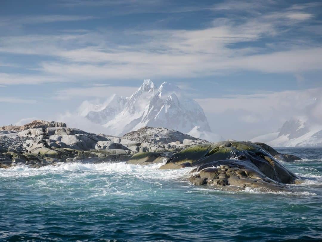 National Geographic Travelさんのインスタグラム写真 - (National Geographic TravelInstagram)「Photo by @acacia.johnson | Surge crashes against the shore of Petermann Island, Antarctica, home to colonies of gentoo and Adélie penguins. In the background looms Booth Island, whose peaks comprise one wall of Antarctica's scenic Lemaire Channel. Follow me at @acacia.johnson for more adventures from Antarctica and beyond. #Antarctica #PetermannIsland #Polar」5月1日 21時52分 - natgeotravel