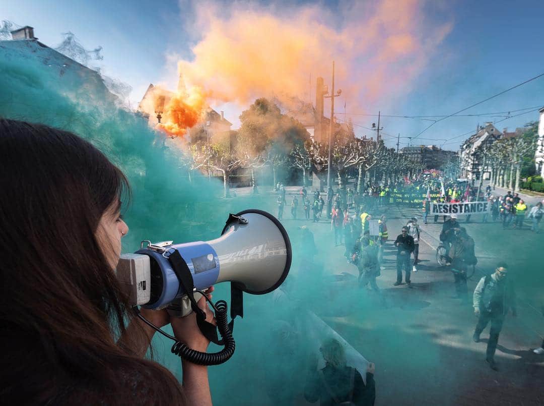 NBC Newsさんのインスタグラム写真 - (NBC NewsInstagram)「A protester speaks through a megaphone as colored smoke bombs billow around the annual #MayDay rally in #Strasbourg, #France. . 📷 @patrickhertzog1 / @afpphoto」5月1日 22時06分 - nbcnews