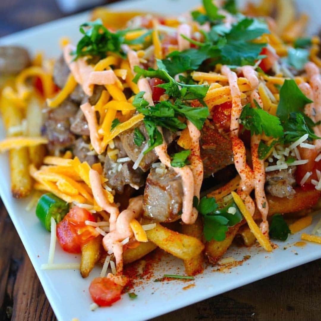 Flavorgod Seasoningsさんのインスタグラム写真 - (Flavorgod SeasoningsInstagram)「Here's my Rib Eye Steak Bites over Pizza Fries and a Pizza Cheese Sauce🍕🍕⁣ -⁣ Build Your Own Bundle Now!!⁣ Click the link in my bio @flavorgod ⁣ ✅www.flavorgod.com⁣ -⁣ The fries were baked and the steak was a flash sear.⁣ -⁣ Dish ingredients:⁣ 🍕Tomatoes / diced⁣ 🍕Jalapeño / diced⁣ 🍕Cheddar cheese⁣ 🍕Parmesan Cheese⁣ 🍕Parsley⁣ 🍕Cheese Sauce* / recipe below⁣ 🍕Fries⁣ 🍕Rib Eye Steak bites⁣ 🍕Pizza Seasoning⁣ 🍕Oil for sear⁣ 🍕FlavorGod Pizza Seasoning⁣ 🍕FlavorGod Pink Salt & Pepper⁣ -⁣ Cheese Sauce⁣ -⁣ Ingredients:⁣ 🍴1 cup - milk / divided 🍴3 teaspoons - oat flour /old fashion oats processed to powder in food processor⁣ 🍴1/4 teaspoon - FlavorGod pink Salt & Pepper⁣ 🍴1.5 ounces (about 1/3 cup) - sharp cheddar cheese / shredded⁣ 🍴1 tbsp - FlavorGod Pizza Seasoning⁣ -⁣ Preparation⁣ Total: 10 Minutes⁣ -⁣ 1. Combine 1/4 cup milk and oat flour in a saucepan; stir with a whisk. Stir in FlavorGod Pink salt; bring to a boil over medium heat, stirring frequently.⁣ 2. Reduce heat to low; simmer 2 minutes or until slightly thickened, stirring constantly.⁣ 3. Remove from heat. Stir in cheese until cheese melts.⁣ 4. Serve over fries and steak.⁣ -⁣ -⁣ #food #foodie #flavorgod #seasonings #glutenfree #keto #paleo  #foodporn #mealprep #kosher ⁣」5月3日 0時00分 - flavorgod