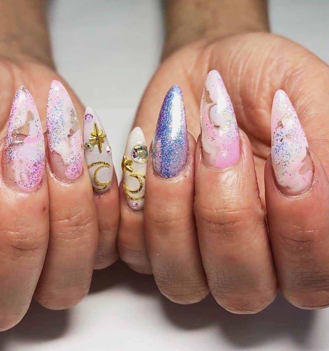 のインスタグラム：「These nails are out of this world 🌟🌙 ✨ Nails by #COSMOPRO @sarahnailsit who used @orly Builder In A Bottle as her base when creating these beauties 💅 ✨ Builder in a Bottle is a soak-off sculpting gel for nail extensions. It applies like a soft gel, but wears like a hard gel, keeping your nails feeling strong yet lightweight! 🙌 Say goodbye to painful nail breaks with #ORLY Builder In A Bottle, available at #cosmoprofbeauty where you are #licensedtocreate flawless nails  #repost #orlyatcosmoprof #orlyinternational #nailinspo #nailartist #nailinspiration #nailart」