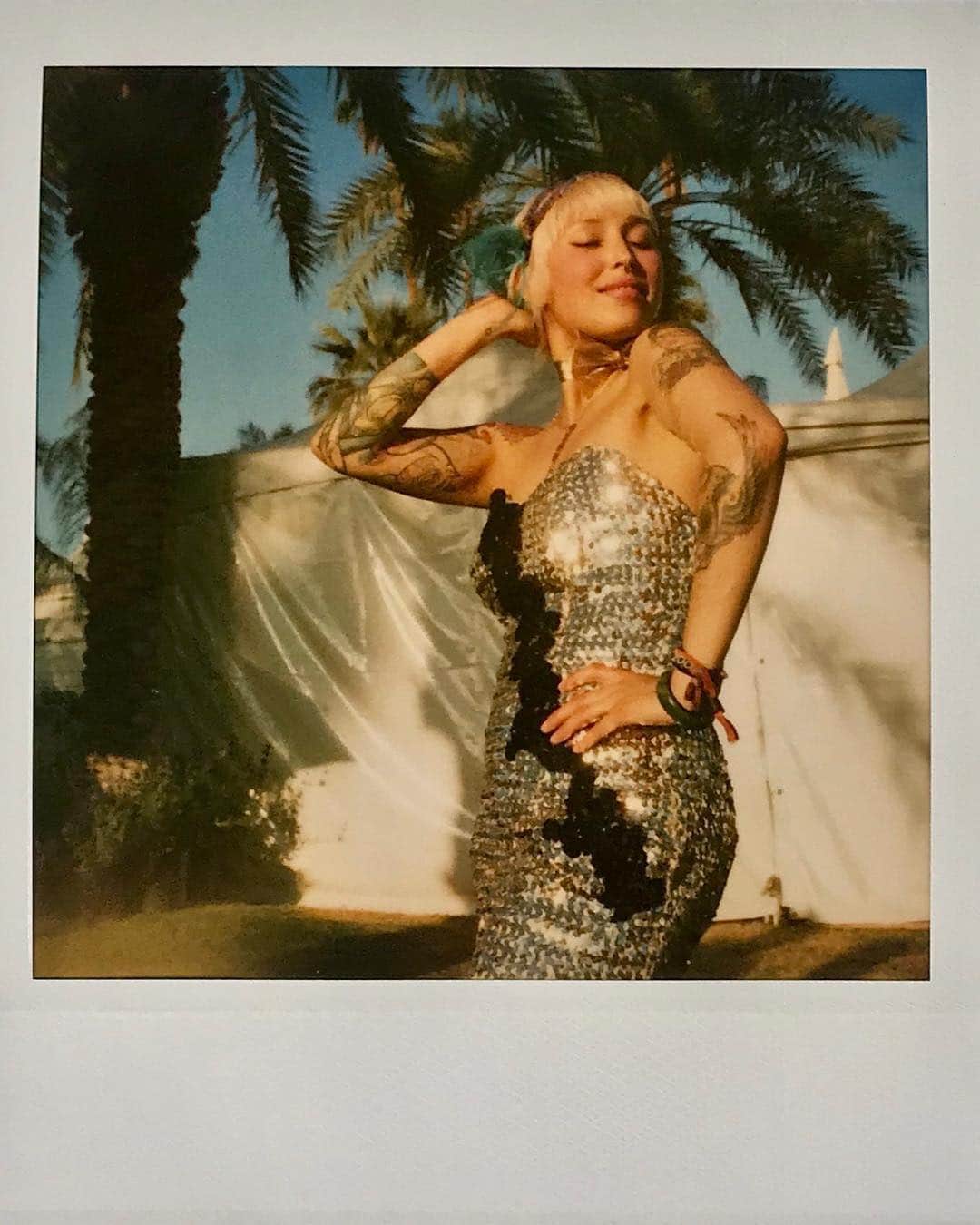 Vogue Runwayさんのインスタグラム写真 - (Vogue RunwayInstagram)「As this year's #Coachella approaches, let's look back at a simpler time at the music festival–to 2007. Photographer @ChristyBush_Public was backstage at Coachella that year, capturing a series of sun drenched, intimate Polaroids of artists and attendees at the festival in Indio, California. The collection serves as a time capsule, before every moment was shared on social media, when things were a little messier, more unguarded, and–arguably–more fun. At the link in the bio, Christy speaks about that time in her life, her fondest memories from these two days in the desert, and the performance that blew her away. Photographed by @christybush_public」4月10日 23時07分 - voguerunway