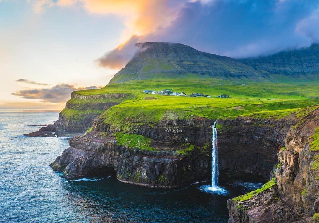 National Geographic Creativeさんのインスタグラム写真 - (National Geographic CreativeInstagram)「Photo by @martinedstrom | A scenic view of the Múlafossur waterfall, iconic to Denmark's village of Gásadalur, Faroe Islands. #FaroeIslands #Waterfall #Denmark」4月10日 22時44分 - natgeointhefield