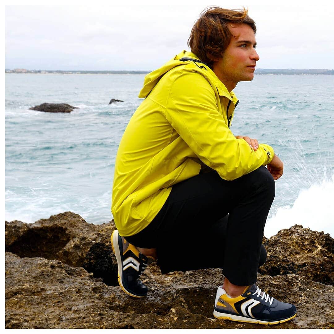 のインスタグラム：「ENJOY THE ELEMENTS “Some people walk in the #rain, others just get wet” - Roger Miller. For those who want to enjoy the #elements, our Amphibiox™ #sneakers keep water out so your feet can happily keep moving, whatever the weather.  Thanks to our @riccardomarca for wearing our waterproof Amphibiox™ total look. Sneakers: Sandford ABX Jacket: Sandford ABX Man  Tap to shop!」