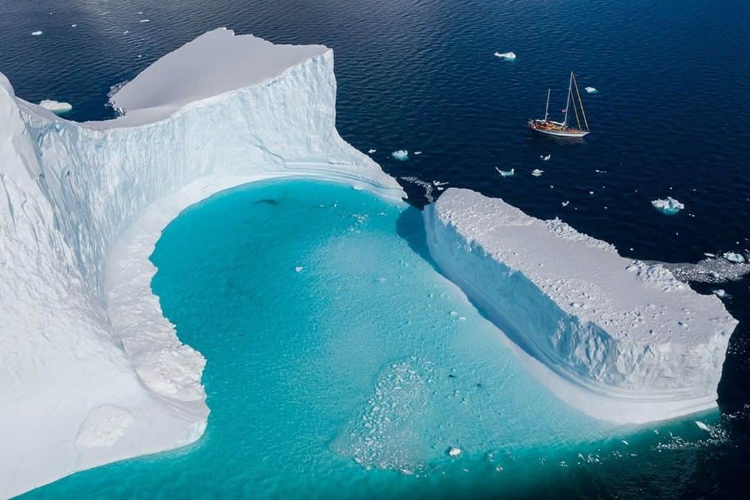 National Geographic Travelさんのインスタグラム写真 - (National Geographic TravelInstagram)「Photo by @daisygilardini | One of the most difficult things to achieve when photographing in Antarctica is bringing home images that convey the grandeur of the landscape and the size of the icebergs. When capturing images in the wilderness we usually tend to exclude the human element, and so underestimate its importance. In this case the image is particularly effective because of the inclusion of the sailboat,  which gives the viewer the right sense of scale. Follow me @daisygilardini for more images and behind-the-scenes stories. #Antarctica #landscapephotography #iceberg #climatechange」4月11日 19時04分 - natgeotravel