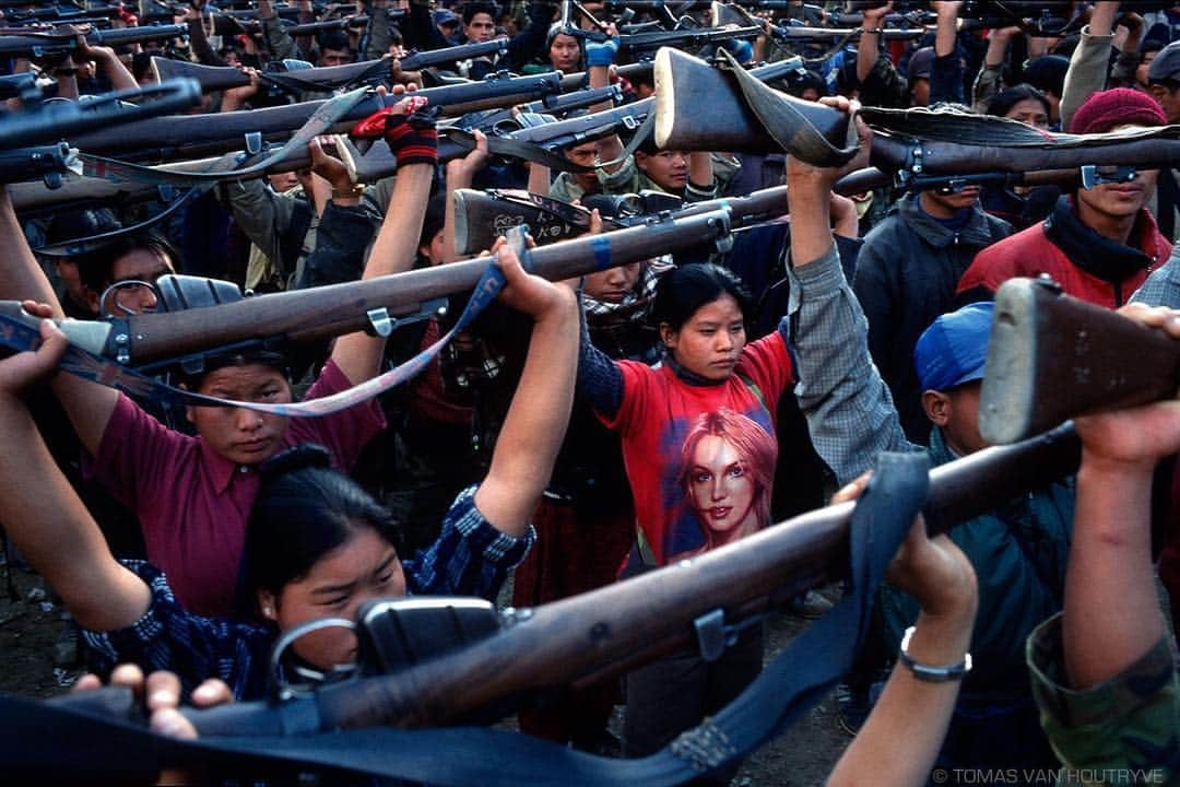 thephotosocietyさんのインスタグラム写真 - (thephotosocietyInstagram)「Photo by @tomasvh // My first in-depth personal photo project took me seven years to complete. Starting in 2004, I visited every county where the Communist Party still rules. This photo is one of the most memorable from my “Behind the Curtains” project, showing a a young Maoist rebel wearing a Britney Spears shirt while doing military drills in rural #Nepal. . . . I’ll be teaching a #workshop about personal projects in #Milan on April 27-28 with @leicaakademieitaly and there a few spots left. . . .  More info on the #Masterclass at https://bit.ly/2SL4z1p or by visiting the link in the @tomasvh bio. . . .  @global_leica_akademie #photography #storytelling #project  #GlobalLeicaAkademie  #behindthecurtains」4月11日 22時06分 - thephotosociety