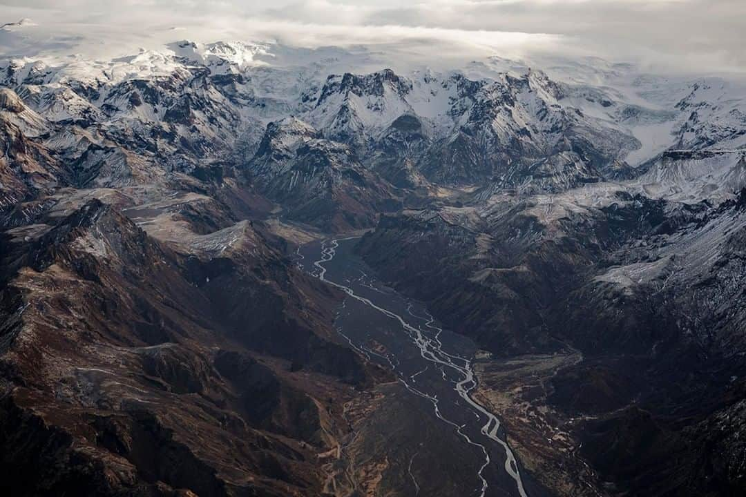 National Geographic Travelさんのインスタグラム写真 - (National Geographic TravelInstagram)「Photo by Matthew Borowick @mborowick | Flying high above Thórsmörk (named for the Norse god, Thór) allows us to see the beautiful mountain ridge and braided rivers nestled between the glaciers of Eyjafjallajökull, Mýrdalsjökull, and Tindfjallajökull. This Is by far one of Icelands most popular hiking areas during the summer months. #iceland #mountains #thorsmork #adventure #hiking」4月15日 4時00分 - natgeotravel