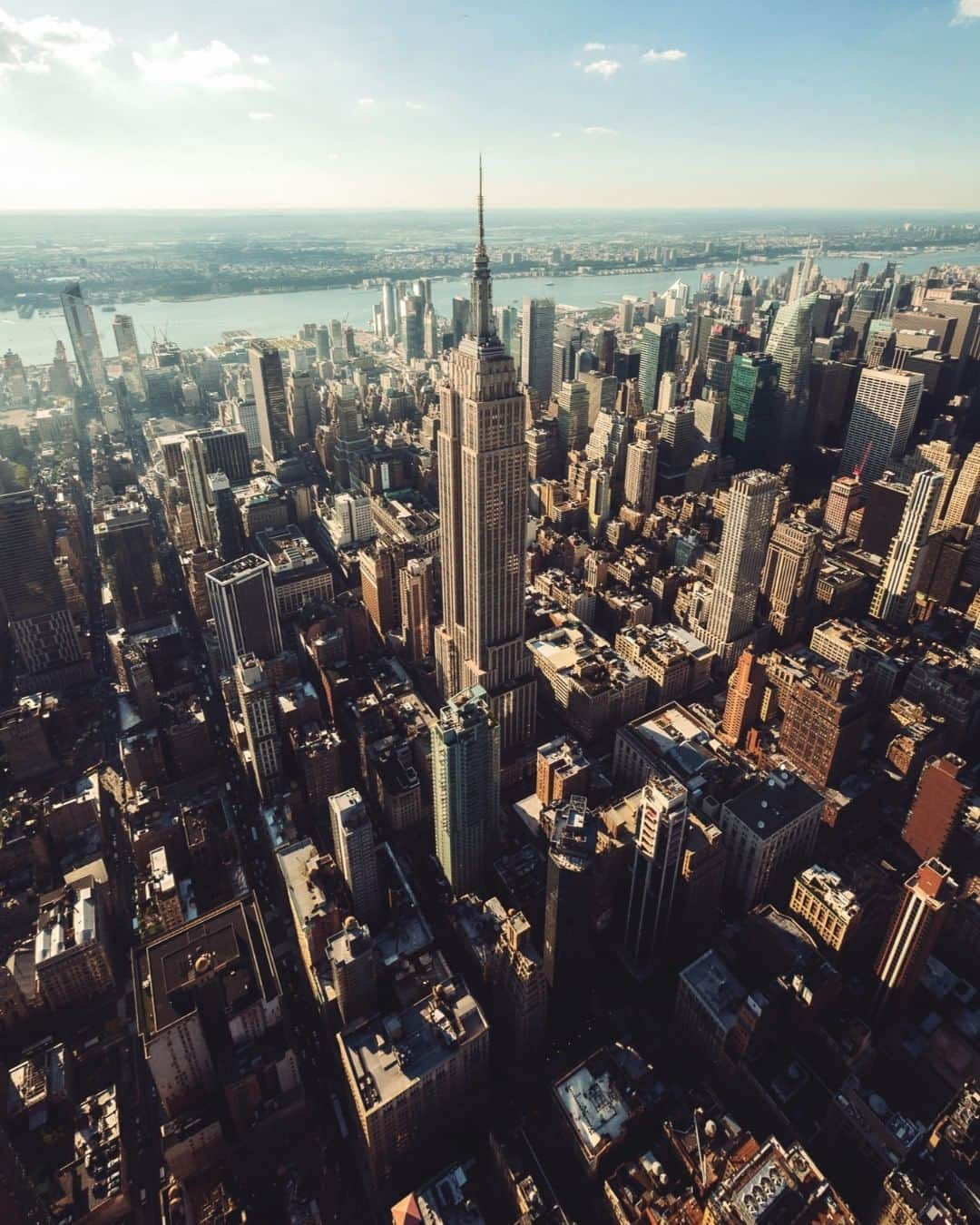 nyonairさんのインスタグラム写真 - (nyonairInstagram)「MANHATTAN FUN FACTS: More than any other style of architecture, the skyscraper defines New York City's skyline. Until 1890, the tallest building in NYC was Trinity Church on Broadway. (284 ft tall). Now the tallest is One World Trade Center at 1,776 ft tall. . There are over 46,486 buildings in Manhattan which is spread around 22.82 square miles (Sounds crowded). . If you could put a price tag on the pure RESIDENTIAL real estate in the city it would be $1.57 trillion USD. Broken down that's $68.7 billion per square mile.. (WOAH!). The. average cost of a home in the city is $1,307,700 . What surprised you? What fact did you know? Would you live here? Do you live here? DROP A COMMENT! . Spring is here! 🚁 Get 35% Off + Free Ground Transportation - Use Code EASTER35! 🚁 . Ultimate flexibility with our BNSL - valid for more than a year. . . . . . #earthpix #bestvacations #loveauthentic#exploremore #moodygrams #streetdreamsmag #complex #stpatricksday #esquire #icapture_nyc #jointhemvmt#bucketlist #timeoutnewyork #wildnewyork#newyork_instagram #lensbible#thingstodoinnyc #adventurelifestyle #travelexperience #adventuretravel#winterinnewyork #traveldeawls #centralpark #timessquare」4月15日 8時10分 - nyonair