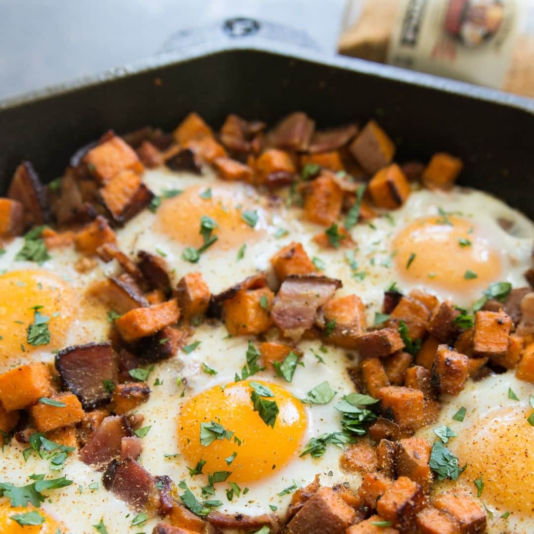 Flavorgod Seasoningsさんのインスタグラム写真 - (Flavorgod SeasoningsInstagram)「Sweet Potato, Bacon and Egg Skillet 🍳🍳🍳⁣ .⁣ Made with:⁣ 👉 #flavorgod Chipotle⁣ 👉 #flavorgod Pink Salt & Pepper⁣ -⁣ On Sale here ⬇️⁣ Click the link in the bio -> @flavorgod⁣ www.flavorgod.com⁣ .⁣ Ingredients:⁣ 1-1.5 lbs sweet potatoes, diced⁣ 1 lb bacon⁣ 6-8 eggs, room temp is best⁣ 2 tbsp solid cooking fat⁣ 1 tsp FlavorGod Pink S+P⁣ 1 tbsp FlavorGod Chipotle⁣ cilantro to garnish⁣ ⁣ Directions:⁣ Place bacon on baking sheet and cook in 400F oven for about 15-20 minutes, or until done. Set aside on paper towels.⁣ ⁣ While bacon is cooking, heat ghee in 12" cast iron skillet over med-high, then add diced sweet potatoes. Season with pink s+p and chipotle seasonings. Cook potatoes for about 10-15 minutes, stirring a few times. Potatoes should be fork tender.⁣ ⁣ Add bacon and stir into potatoes. With a spoon, make little holes to crack the eggs into. You can transfer the skillet to the oven for about 7 minutes to let egg whites set, or turn heat down and cover with a lid to cook eggs.⁣ ⁣ Garnish with cilantro and more #flavorgod!」4月15日 22時58分 - flavorgod