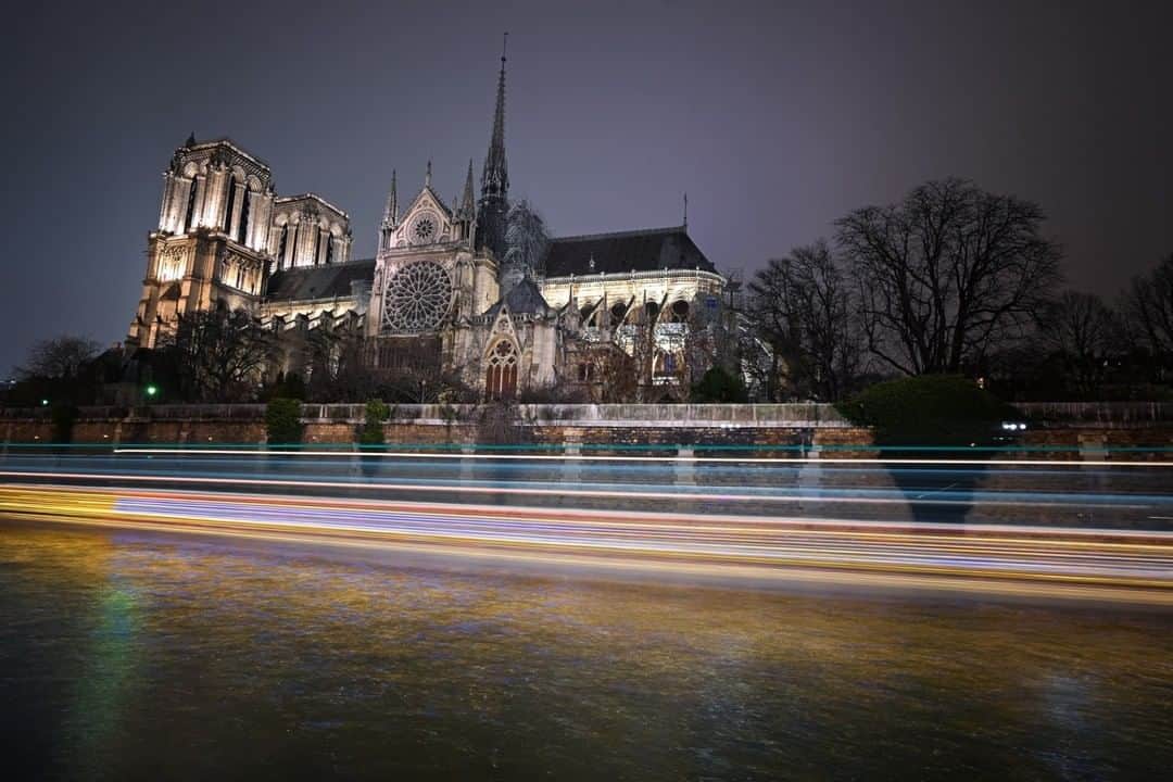 National Geographic Travelさんのインスタグラム写真 - (National Geographic TravelInstagram)「Photo by @ladzinski | Lights streaming along the Seine river from passing boats underneath the Notre Dame Cathedral in Paris. I photographed this scene only months ago on New Years Day, I’m heart broken to hear of the fire. This iconic cathedral is a landmark of the city dating back to the 13th century. It was a place I visited every-time I was in Paris and gave me a sense of peace and warmth. It’s hard to imagine it no longer standing proud, brightly illuminated among a courtyard full of people enjoying its beauty. Wishing the people of France the deepest condolences on this terrible day.」4月16日 12時37分 - natgeotravel