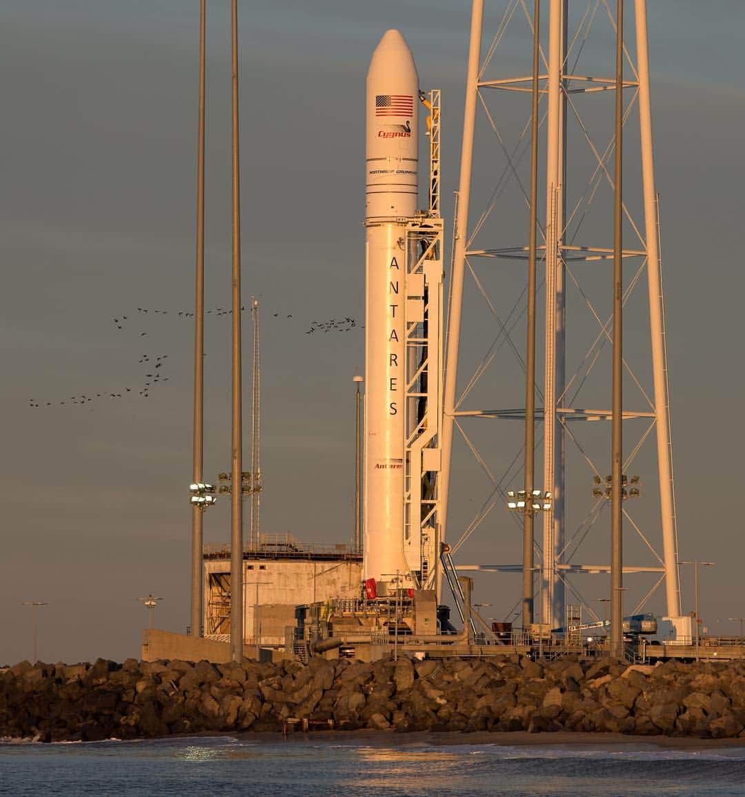 NASAさんのインスタグラム写真 - (NASAInstagram)「🚀🚀🚀 A @NorthropGrumman #Antares rocket carrying a #Cygnus resupply spacecraft is seen on Tuesday, April 16 during sunrise on Pad-0A at @NASAWallops Flight Facility in Virginia. Set to launch on Wednesday, April 17 at 4:46 p.m. EDT, this will be the company's 11th contracted cargo resupply mission to the International Space Station (@ISS) to deliver about 7,600 pounds of science and research, crew supplies and vehicle hardware to the orbital laboratory and its crew.  Credit: NASA/Bill Ingalls #Launch #Rocket #NASA #LaunchPad」4月17日 1時56分 - nasa