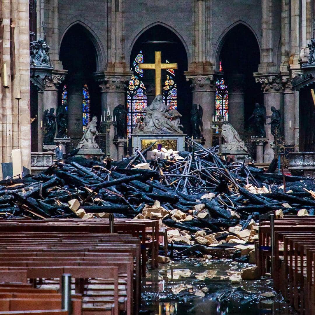 ニューヨーク・タイムズさんのインスタグラム写真 - (ニューヨーク・タイムズInstagram)「The Cathedral of Notre-Dame still stands, and a devastated France has one unwavering goal: It will be rebuilt. This photo shows the interior of the church a day after a devastating fire swept through the cathedral, which is an iconic symbol of the beauty and history of Paris. The 800-year-old Gothic masterwork is now scorched, battered and missing its spire and much of its roof. President @EmmanuelMacron of France said he hoped the cathedral could be rebuilt within 5 years — though at least one expert said it could take 3 times that long. Officials are treating Monday’s fire as an accident, not a deliberate act, and the cause is still unknown. Visit the link in our profile to see more from inside the cathedral and to read the latest developments. Christophe Petit Tesson shot this pool photo.」4月17日 6時58分 - nytimes