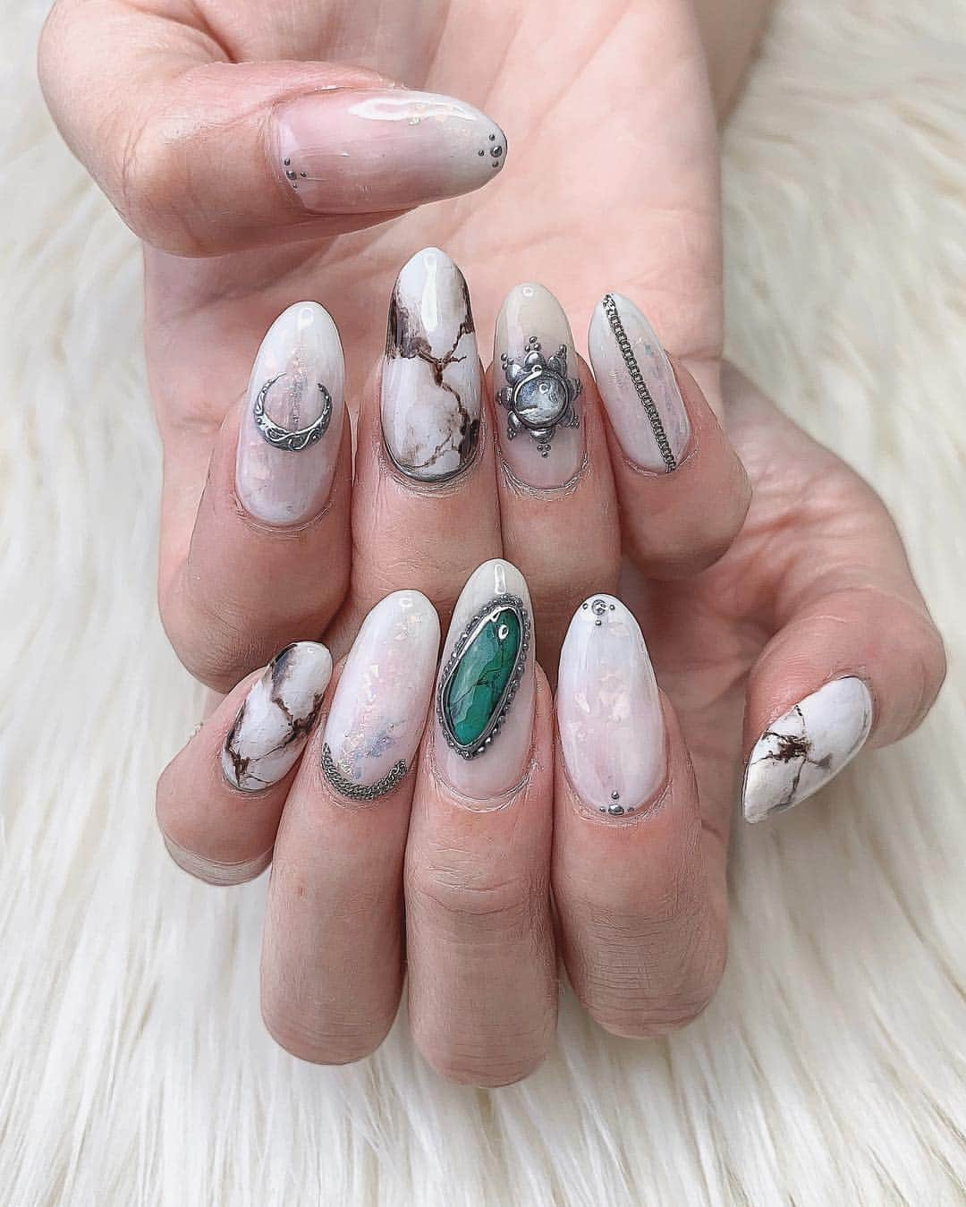 Nailsalon Cielさんのインスタグラム写真 - (Nailsalon CielInstagram)「連投ごめんなさい💦﻿ ﻿ ﻿ 出来たてのデザインを﻿ 早くお届けしたくて🤲⭐️﻿ ﻿ 天然石と天然石アートの組み合わせ！﻿ ﻿ チェーン以外は全部﻿ 気合いで手描きです😠💭✍️﻿ ﻿ ﻿ ﻿ ‣﻿﻿﻿ ‣﻿﻿﻿ ‣﻿﻿ ‣﻿﻿﻿ ﻿﻿﻿ ☪︎❶gemstone（ジェムストーン＝天然石パーツ）﻿﻿﻿﻿ ☪︎❷silver jewelry,silverring（シルバージュエリー,シルバーリング、他シルバーアート）﻿﻿﻿﻿ は既成パーツではなく、﻿﻿﻿﻿ 全てジェルで作っている物なので、﻿﻿﻿﻿ 別料金になります。﻿﻿﻿﻿ ﻿﻿﻿﻿ 直接爪の上に作っていきますので、﻿﻿﻿﻿ お時間を頂きます。ご了承ください🙇‍♀️💦﻿﻿﻿﻿ ﻿﻿﻿﻿ ☪︎❶,❷をご希望のお客様へ﻿﻿﻿﻿ お時間の調整の為、ホットペッパーご要望枠内にシルバーアート希望とご記入下さい。御新規のお客様はお時間の都合でお断りする事もございます。﻿﻿﻿﻿ ﻿﻿﻿﻿ ジェルオフがある場合は必ずオフメニューを追加﻿﻿﻿﻿ して下さい★﻿﻿﻿﻿ ﻿﻿﻿﻿﻿﻿﻿ ――――――――――――――――﻿﻿﻿﻿ ――――――――――――――――﻿﻿﻿ hotpepperBeauty net予約↓↓↓ ﻿﻿﻿﻿ ﻿﻿﻿ https://beauty.hotpepper.jp/smartphone/kr/slnH000217395/﻿﻿﻿﻿ ・﻿﻿﻿﻿ #ネイル#ネイルサロン﻿﻿﻿﻿ #instagood#instanails#jelnail#ネイルアート#手描きアート#loveit#ジェル#ジェルネイル#個性派ネイル#トレンドネイル#お洒落ネイル#newnails#福岡ネイル#cute#beautiful#art#ネイルサロン#天然石ネイル#韓国#ネイル#春ネイル#福岡ネイルサロン#cool#シルバージュエリーネイル#春ネイル2019#天然石柄ネイル#エスニックネイル」4月17日 22時32分 - myanail