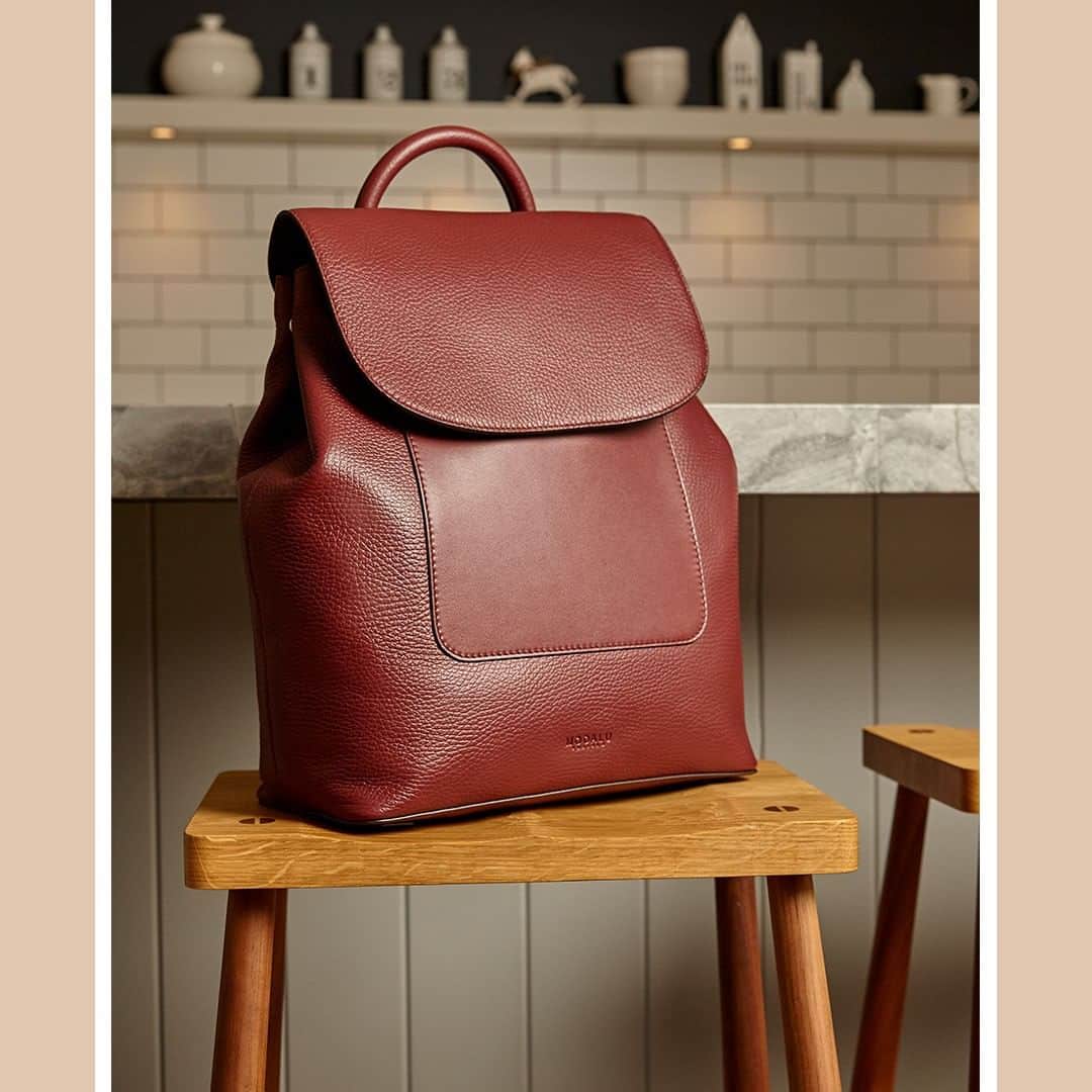 のインスタグラム：「A luxurious take on a must-have style, the Alice backpack is a timeless silhouette in a bold burgundy hue. Was £199, now £112 #ModaluMoments #LeatherBackpack #LeatherHandbags」