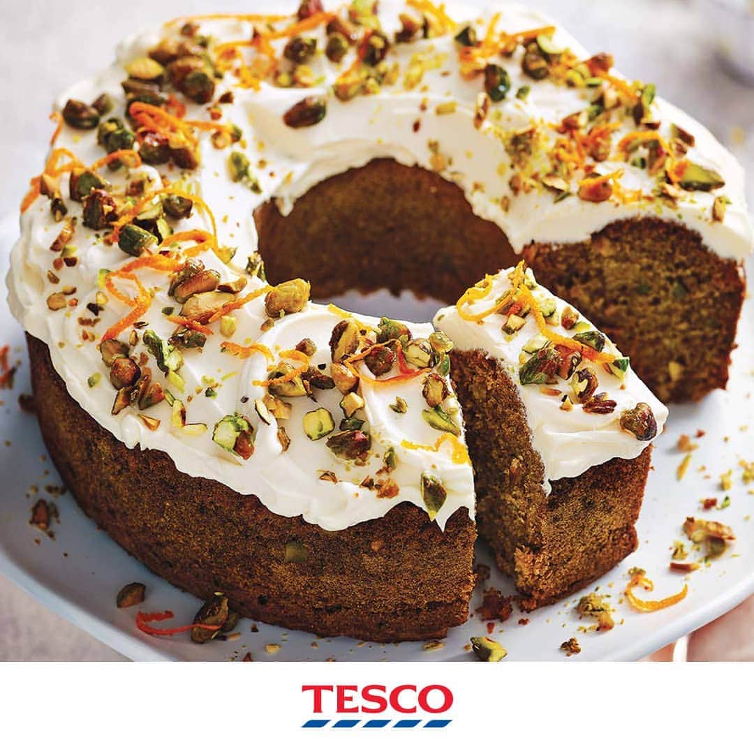 Tesco Food Officialさんのインスタグラム写真 - (Tesco Food OfficialInstagram)「Want to lure the Easter Bunny to your house first? This carrot, pistachio and maple bun cake might do the trick! It’s an irresistible medley of sweet, spiced flavours and bright carroty goodness - #HopToTesco🐰 and grab everything you need for a great weekend bake.  Ingredients  butter, for greasing 180g shelled pistachios 300g plain flour 1 tsp baking powder ½ tsp bicarbonate of soda 2 tsp mixed spice 2 tsp ground cinnamon 1 tsp ground ginger ½ tsp fine salt 1 orange, zested 300ml sunflower oil 280g light muscovado sugar 4 large eggs, lightly beaten 300g carrots (about 3 medium carrots), peeled and coarsely grated For the topping 3½ tbsp maple syrup 100g soft cheese 100ml double cream  Method  1. Preheat the oven to gas 4, 180°C, fan 160°C. Grease a 2.4ltr bundt tin liberally with butter, making sure you cover every part of the inside.  2. Coarsely chop 150g of the pistachios, or pulse in a food processor. Mix the flour, baking powder, bicarb, spices, salt and most of the orange zest in a large bowl and set aside.  3. In another bowl, whisk the oil, sugar and eggs together until well combined, then stir in the grated carrot. Make a well in the dry ingredients and pour in the carrot mixture, whisking until the mixture is just combined. Pour the batter into the prepared tin and bake for 45 mins or until a skewer inserted into the centre comes out clean. Cool in the tin for 15 mins before carefully turning out onto a wire rack and setting aside to cool completely.  4. Meanwhile, put the remaining 30g pistachios in a small baking dish, toss with ½ tbsp of the maple syrup and bake for 2-3 mins until sticky and just toasted but not brown. Tip onto a plate and, once cool, roughly chop.  5. Put the remaining maple syrup in a mixing bowl with the soft cheese and double cream and whisk until it just holds its shape. Swirl the frosting over the cake using the back of a spoon, and scatter over the candied pistachios and remaining orange zest to serve. Will keep in an airtight container in the fridge for up to 2 days.」4月19日 21時06分 - tescofood