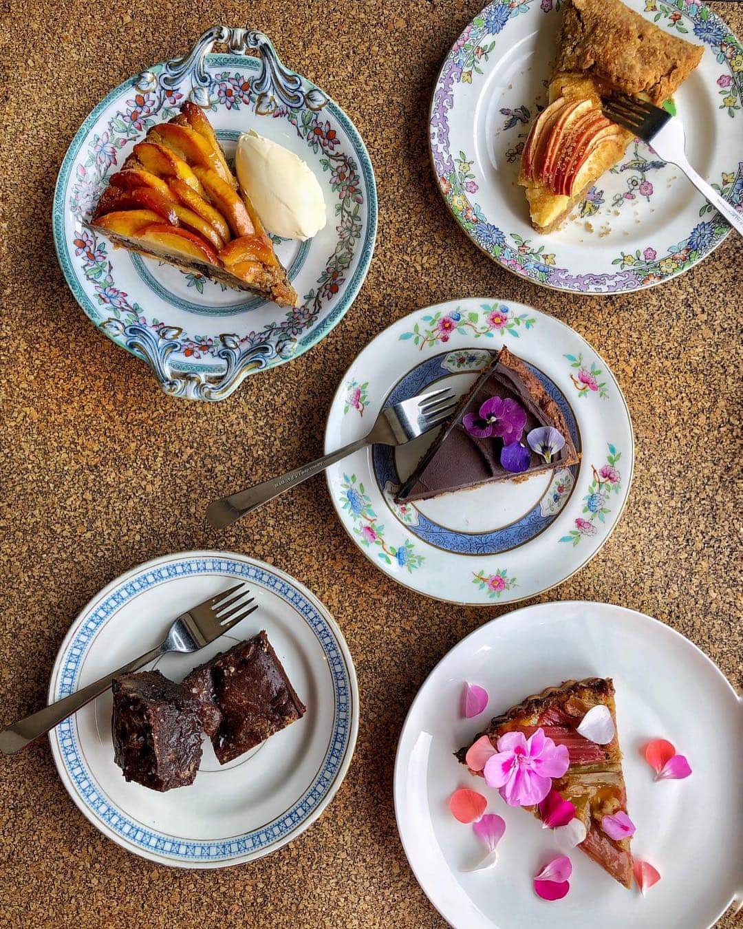 @LONDON | TAG #THISISLONDONさんのインスタグラム写真 - (@LONDON | TAG #THISISLONDONInstagram)「@felicityspector says... here with a spectacular table of cakes from @HenriettaInman cafe @yardarm_leyton - so hard to choose what to have so I’ve gone for a slice of rhubarb frangipane tart, some sticky gooey fruit and nut brownies, some chocolate fig cake with a whipped ganache, a slice of apple and custard galette and some pear and hazelnut frangipane tart with plenty of cream... this should keep me going! 🤣🙈 Henrietta is one of my best friends and her baking is truly amazing - she is mid way through a year long residency here in #Leyton and if I could just move in and eat here all day long I would. She cooks with seasonal, local produce, some of it from her parents kitchen garden in Suffolk... and everything about her cafe is full of love and joy. Have a great Easter weekend everyone and tag a friend who needs some delicious cake! 👇🏼👇🏼 // #thisislondon #london #londonfood #welovecake 🤣👌🏼」4月20日 18時38分 - london