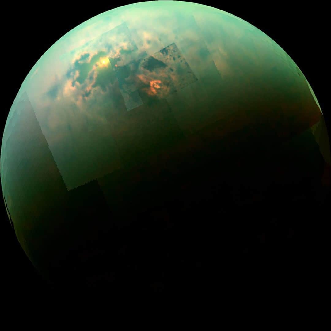 NASAさんのインスタグラム写真 - (NASAInstagram)「Specular Spectacular: During its mission, our Cassini spacecraft captured the sun glinting off of Titan's north polar seas, seen in this near-infrared, color mosaic from August 21, 2014. The sunglint, also called a specular reflection, is the bright area near the 11 o'clock position at upper left. This mirror-like reflection, known as the specular point, is in the south of Titan's largest sea, Kraken Mare, just north of an island archipelago separating two separate parts of the sea. The southern portion of Kraken Mare displays a "bathtub ring" -- a bright margin of evaporate deposits -- which indicates that the sea was larger at some point in the past and has become smaller due to evaporation. The deposits are material left behind after the methane & ethane liquid evaporates, somewhat akin to the saline crust on a salt flat.  Image credit: NASA/JPL-Caltech/University of Arizona/University of Idaho #Saturn #Titan #Sunglint #SolarSystem #NASA」4月22日 0時37分 - nasa