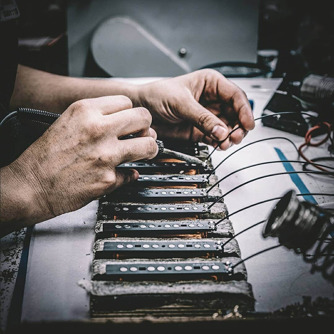 Fender Guitarさんのインスタグラム写真 - (Fender GuitarInstagram)「This week we're looking at how pickups are made, here's how it works.  1. WINDING: Pickup winding specialists use purpose-built machines to wind magnet wire onto bobbins. 2. ASSEMBLY: Single-coil wound bobbins get assembled into pickups by attaching covers, baseplates and leads, according to pickup model. Humbucking pickups get matched with a second coil, both are attached to a larger baseplate and specially wired to reduce hum. 3. POTTING: Most Fender pickups are “wax-potted” to reduce microphonic feedback. This involves using a custom vacuum potting machine to draw melted wax into the windings of the pickup. Depending upon the historic spec of a particular model or series, some pickups are shellac-potted or not potted at all. 4. INSTALLATION: Completed pickups are installed into pickguard assemblies, bridges or bezels, which are then screwed into guitars. Pickups can also be screwed directly into the body, such as Telecaster neck, Jazz and Precision Bass pickups. #InternationalGuitarMonth」4月22日 1時09分 - fender