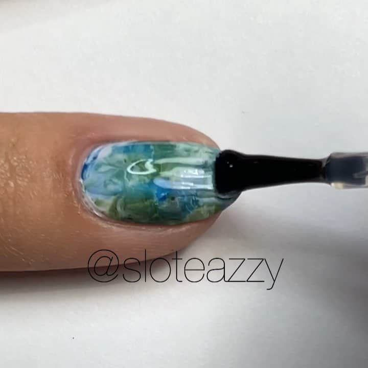 Yasmeenのインスタグラム：「Easy earth inspired nail art for #EarthDay 🌍♻️ All polishes used are @dermelect : Verdure (dark green), Vivacious (light green), Fearless( blue), Above It (light blue), and Sugarhill (white). Peel off barrier is called Edge Perfection from Amazon, Stamper from AliExpress.  Song: I Can’t Get Enough by benny blanco, Tainy, Selena Gomez & J Balvin  #nailsbysloteazzy #sloteazzytutorials」