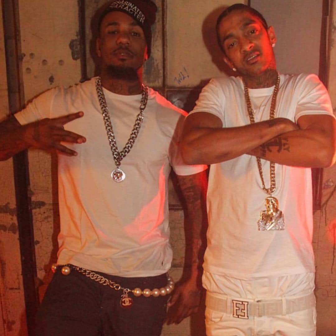 ゲームのインスタグラム：「Had hella fights & fell out with 1/2 my hood the time I took you on tour. Most niggas I still ain’t cool wit to this day. A young blood nigga from the westside of Compton bringing a gang of rollin 60’s crips on tour was doing the most. I had to explain daily to my homies, how it was bigger than Compton, bigger than LA & that having that state of mind would only get us so far in this shit... My niggas that stayed down with me saw my vision come into fruition & the niggas who didn’t get it then & still don’t now are somewhere mad & bitter as fuck with nothing but hate in their heart because we kept it moving & made our union BIGGER THAN LIFE. Nip used to hit the stage & perform and nobody would really be into it because like any new artist, people don’t know your music or aren’t familiar with your face so the 1st time you touch the stage they just stare at you waiting to see what energy you put out before they give theirs back. He started off a lil hesitant but he did his thing & then came off stage after his set & said “Chuck, these niggas don’t fuck wit my shit”. I would say in return “Naw, nigga.. these are Game fans & they just know you or the music yet but watch in a couple shows when you get comfortable, you gone kill it”. I told my nigga the same thing happened to me when @snoopdogg took me on tour, u just gotta push through bro. We were in Dallas, Texas then. Next night we in Houston & I told him before he went on “Tonite, just go out there close ya eyes & spit that shit from ya heart as if nobody was in the crowd” & then open your eyes & I bet you see a a difference. 20 min later, he came off stage smiling big as hell & said “I got these niggas now Chuck, I know what to do”. From that moment on, my nigga had everything he needed to push forward & put everything into motion for himself & look at what he became.. Look at what he did, was able to accomplish for his people & this was only the beginning. The world didn’t know what was to come in the next couple months & the plans he had to expand from Crenshaw & Slauson to other neighboring hoods, cities etc.. They took my nigga way 2 early & that’s what hurts the most #OneNipPostADayTiliFadeAway 🏁」