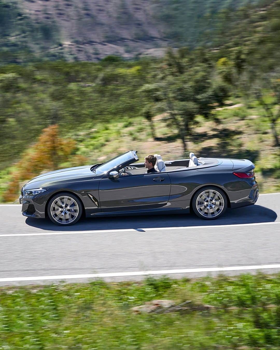 BMWのインスタグラム：「Imposing sovereignty on the road. THE 8. #THE8 #BMW #8Series #Convertible __ BMW M850i xDrive Convertible: Fuel consumption in l/100 km (combined): 10.0 - 9.9. CO2 emissions in g/km (combined): 229 - 225*; *All performance, fuel consumption and emissions figures are provisional. The values of fuel consumptions, CO2 emissions and energy consumptions shown were determined according to the European Regulation (EC) 715/2007 in the version applicable at the time of type approval. The figures refer to a vehicle with basic configuration in Germany and the range shown considers optional equipment and the different size of wheels and tires available on the selected model. The values of the vehicles are already based on the new WLTP regulation and are translated back into NEDC-equivalent values in order to ensure the comparison between the vehicles. [With respect to these vehicles, for vehicle related taxes or other duties based (at least inter alia) on CO2-emissions the CO2 values may differ to the values stated here.] The CO2 efficiency specifications are determined according to Directive 1999/94/EC and the European Regulation in its current version applicable. The values shown are based on the fuel consumption, CO2 values and energy consumptions according to the NEDC cycle for the classification. For further information about the official fuel consumption and the specific CO2 emission of new passenger cars can be taken out of the „handbook of fuel consumption, the CO2 emission and power consumption of new passenger cars“, which is available at all selling points and at https://www.dat.de/angebote/verlagsprodukte/leitfaden-kraftstoffverbrauch.html.」