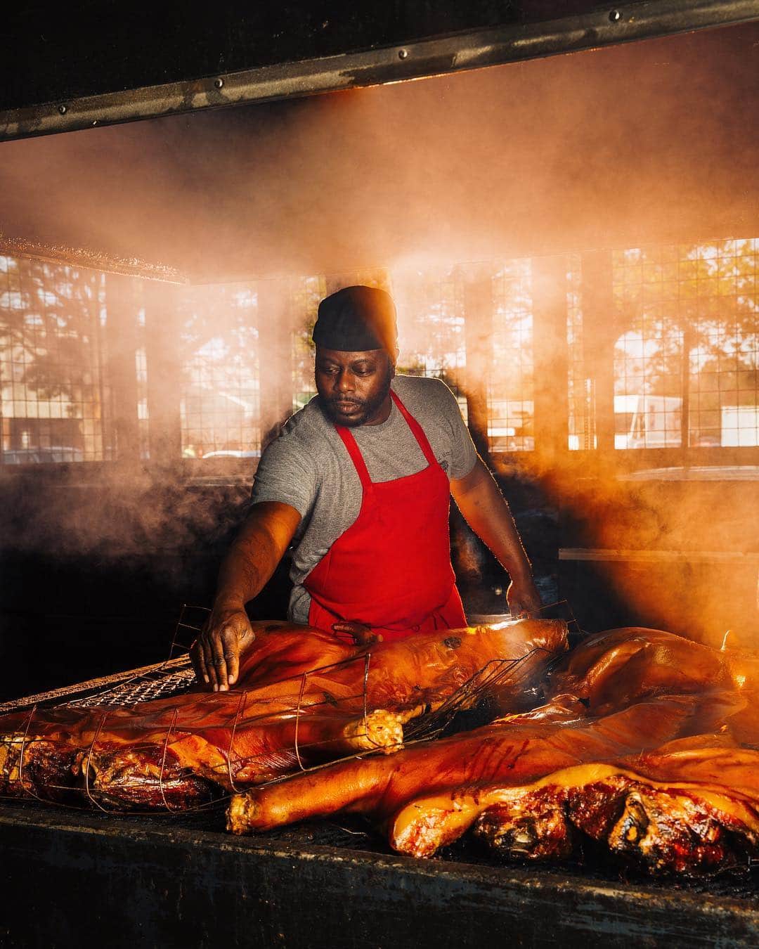 thephotosocietyさんのインスタグラム写真 - (thephotosocietyInstagram)「Photo by @MichaelGeorge // I joked with Rodney Scott that his famous BBQ restaurant in Charleston must be one of the few James Beard award-winning locations with a drive-thru. Rodney is known for smoking whole hogs (seen here). They sometimes go through 10+ per week and along with an expansive menu, Rodney is bringing some of the histories behind southern BBQ back to the forefront. His family has been in the BBQ business for generations, and he wants to remind people that BBQ is an American tradition started by enslaved Africans. This image is for a series I produced for @natgeotravel focusing on the city of Charleston and its local culinary heroes. Swipe to see a detail. // #rodneyscott #rodneyscottsbbq #natgeotravel #natgeo #bbq #bbqhistory #southernbbq #thesouth #southernfood #charleston #charlestonsc #charlestonfood #southcarolina」4月27日 22時29分 - thephotosociety