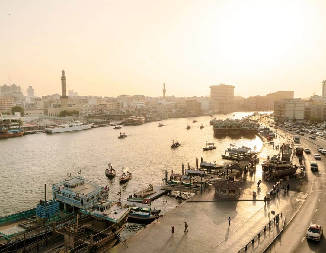 National Geographic Travelさんのインスタグラム写真 - (National Geographic TravelInstagram)「Photo by @lucalocatelliphoto | Echoes of Old Dubai linger around the Creek, the harbor where the city was born. The atmospheric area houses the offices of the Emirate’s ruling Sheikh and dozens of foreign consulates. Dhows still ply its waters for tourism and trade. Having ancient roots, Dubai is today one of the world's fastest growing cities and gives us a glimpse into the future of our cities. A decade ago Dubai had one of the largest ecological footprints of any city in the world, yet by 2050 it wants to have the smallest. Can it get there? My work revolves around the making of the future, how our society transitions through new ways of living, and how technology is changing our approach to the environment and to our cities. I’ve embarked on a journey with @natgeo to showcase how Dubai aims to become one of the world’s greenest cities. Follow me @lucalocatelliphoto to find out more about the Dubai story I covered for @natgeo #Dubai #environment #creek #harbour #sunset #city」4月28日 4時18分 - natgeotravel