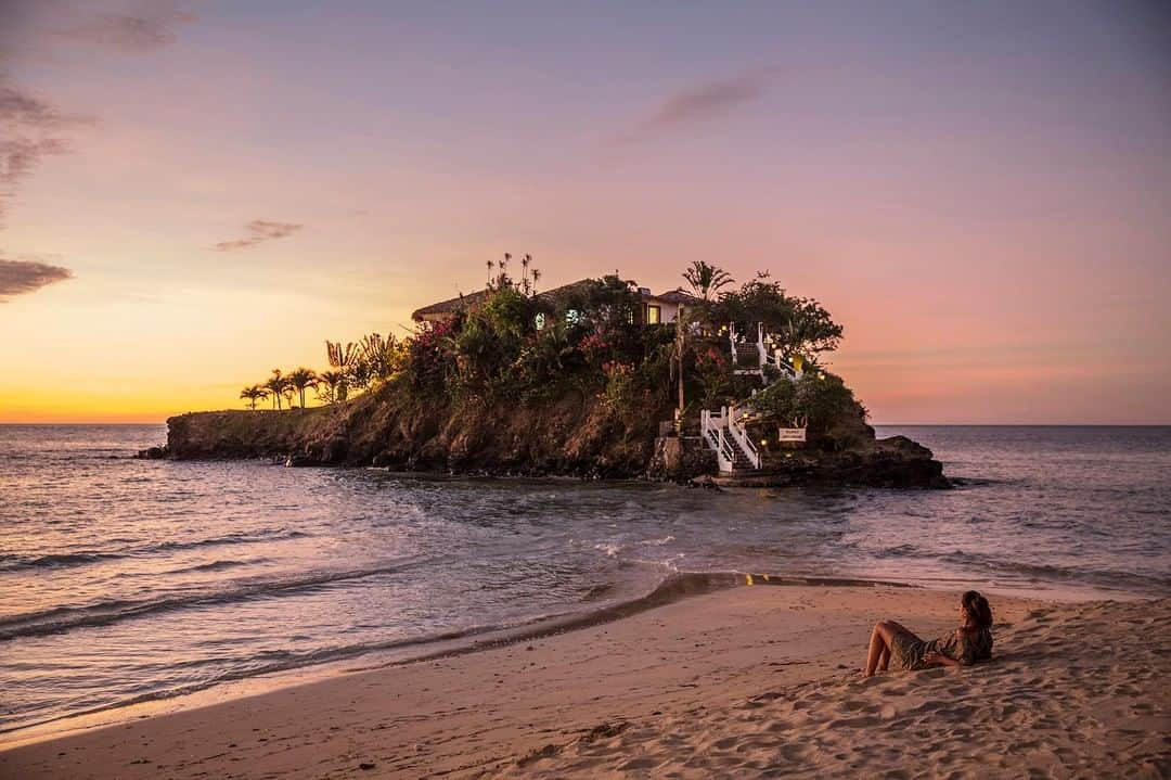 National Geographic Travelさんのインスタグラム写真 - (National Geographic TravelInstagram)「Photo by @andrea_frazzetta | Island of Nosy Be, Madagascar, a tourist enjoying the sunset. In the background is the "Pily-Pily”, a restaurant located on a rock. The high tide fades regularly every day during lunch hours and so is easy to reach the place by walking. To see more photos from my travels, follow me @andrea_frazzetta #madagascar #africa」4月28日 19時03分 - natgeotravel