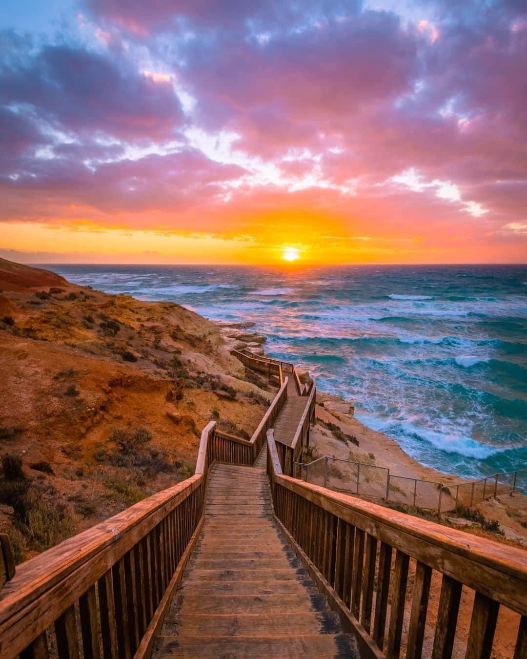 Australiaさんのインスタグラム写真 - (AustraliaInstagram)「Step on down Portie’s Stairs to reach remarkable @southaustralia scenery. 🌅 According to @nathangodwin, “there is something truly special about this place as a whole,” and we think that the epic ocean views or the amazing #SouthPortBeach that awaits at the end of these #stairs might have something to do with it! Located only a 40-minute drive from #Adelaide, this beach on the @officialfleurieupeninsula is a favourite day trip for city dwellers. Enjoy it as the locals do; race down the stairs, take a dip in the ocean, then get some fish and chips from the local shop down the road and settle in to watch the sunset.  #seeaustralia #seesouthaustralia #fleurieupeninsula #PortNoarlunga #travel #explore」4月28日 15時00分 - australia