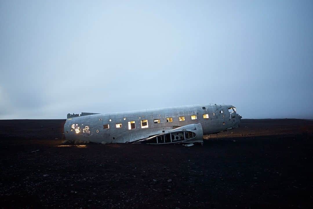 National Geographic Travelさんのインスタグラム写真 - (National Geographic TravelInstagram)「Photo by @mborowick | One of the many big tourist attractions in Iceland is to visit the abandoned US Navy Douglas Super DC-3 airplane that crash landed in 1973 on Sólheimasandur's black sand beach in Southern Iceland. Thankfully everyone onboard survived. The interior is lit by flashlight in the long exposure nighttime photograph, giving it a warm glow. #iceland #airplane #crash #blacksandbeach #travel」5月28日 7時04分 - natgeotravel